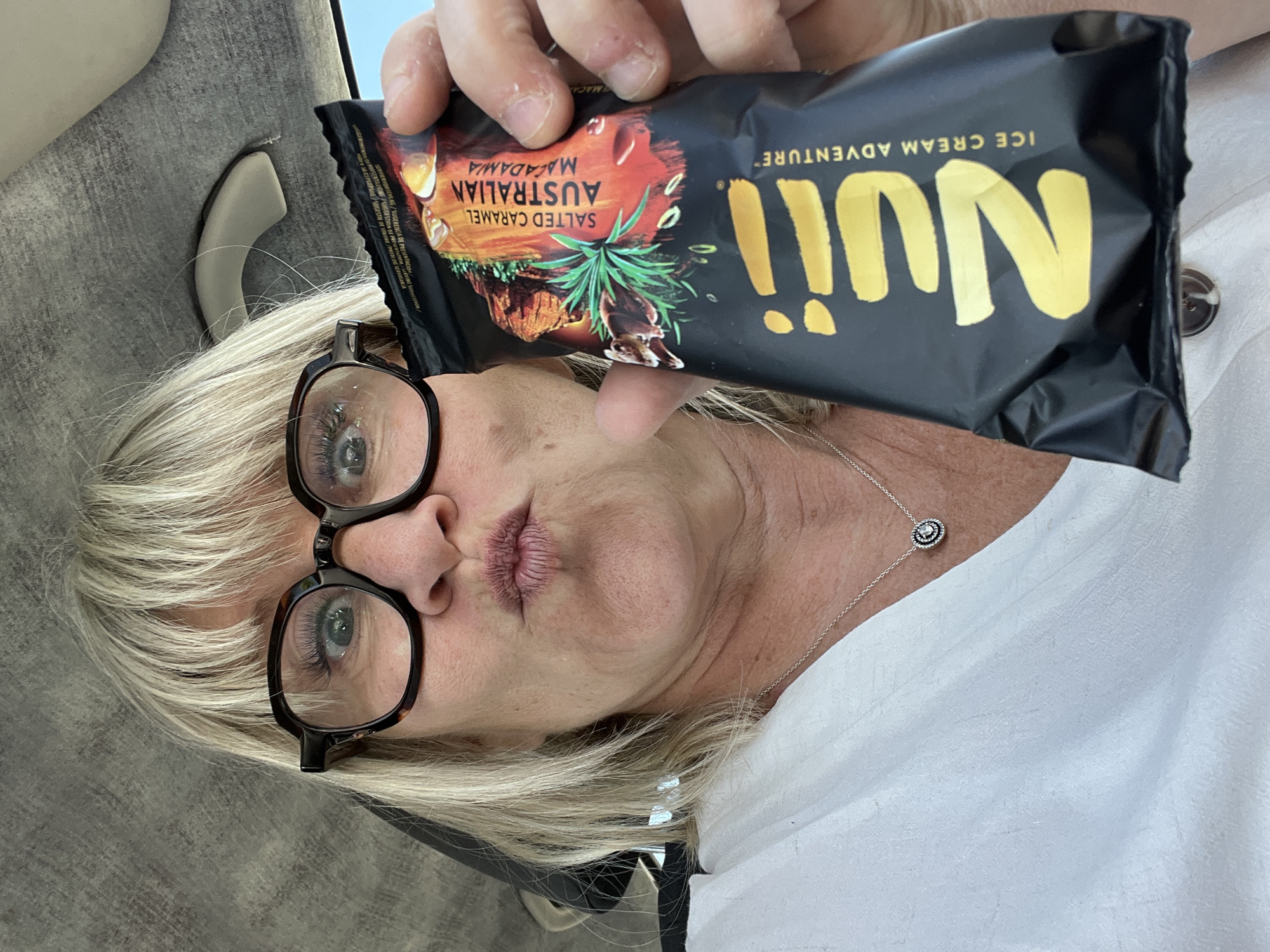 Woman enjoys premium ice cream bar in Saint-Galmier