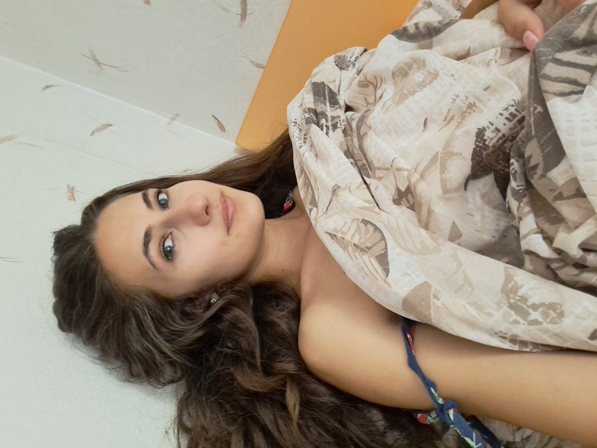 Lazy morning in a Chepintsi bedroom, with a nature painting nearby