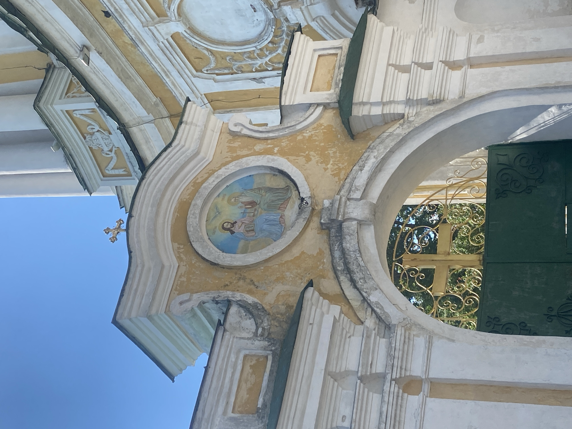 Tourist documents historic churches during sunny morning walk in Chernihiv
