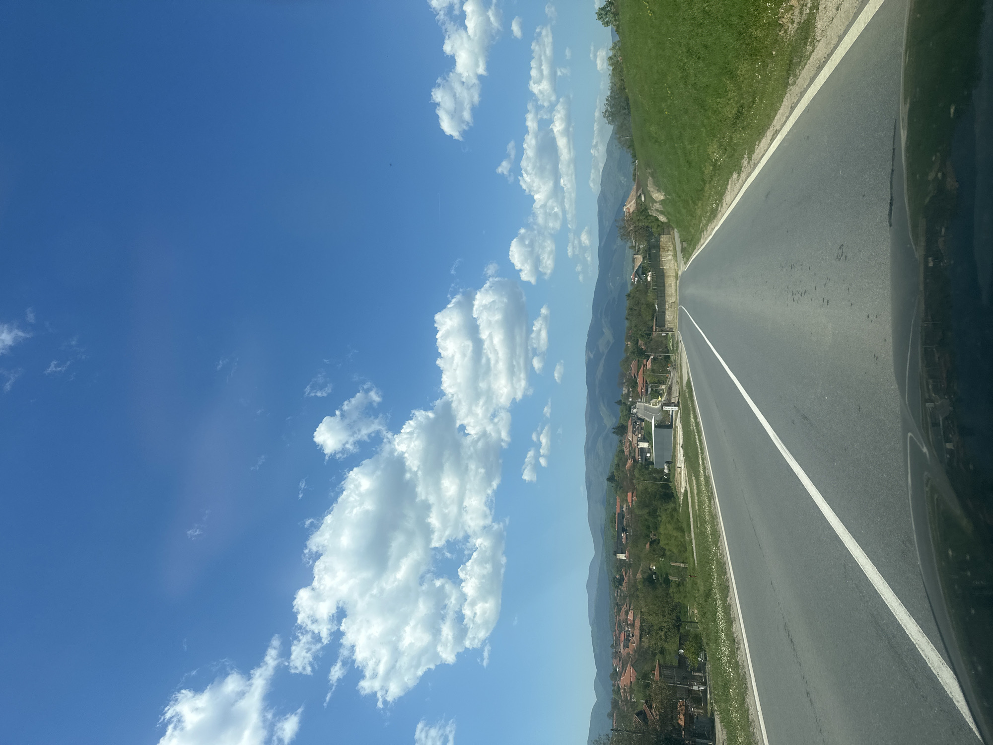 Road views captured showing mixed residential and wooded landscape