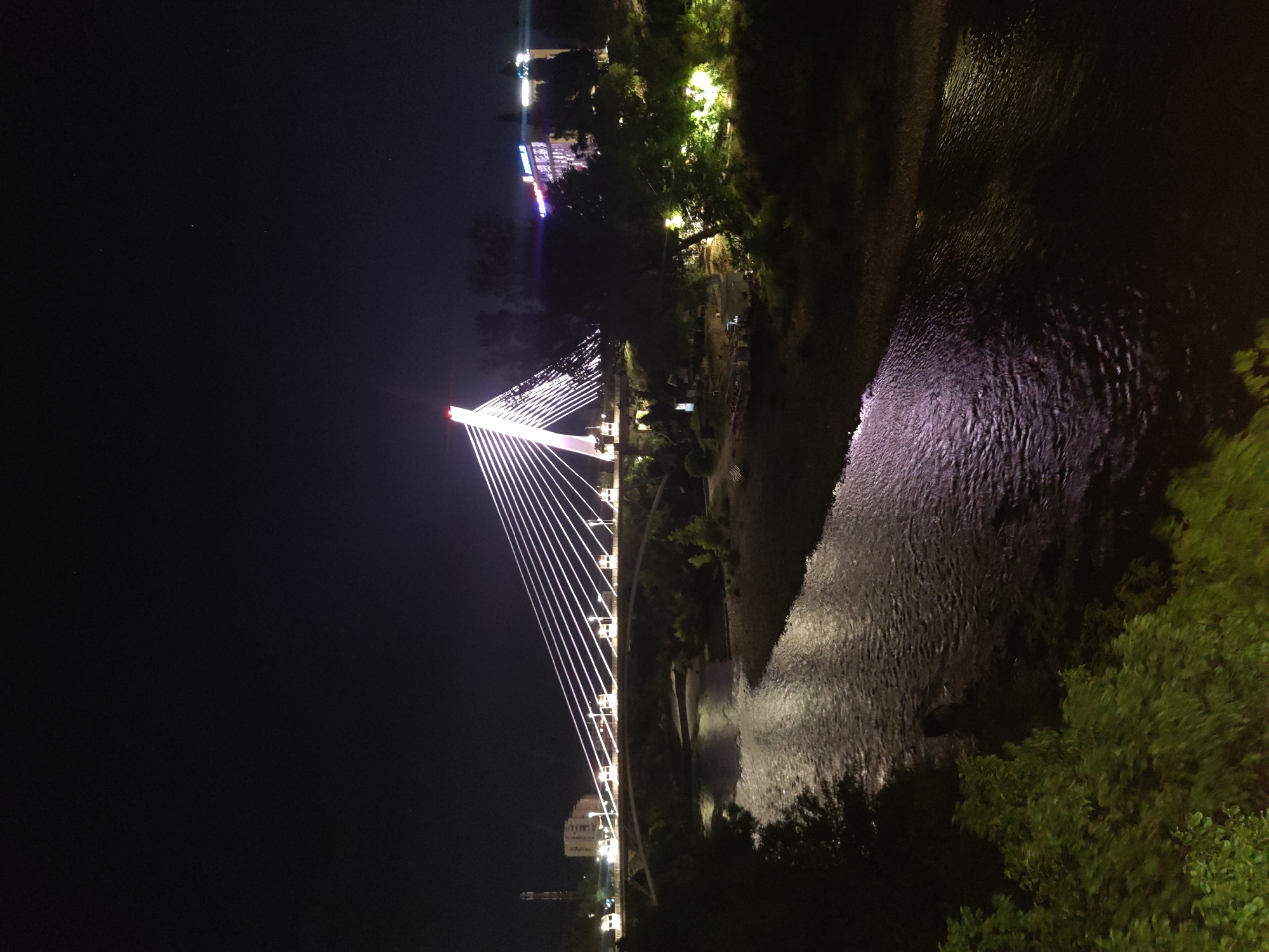 Podgorica's Millennium Bridge glowing after dark