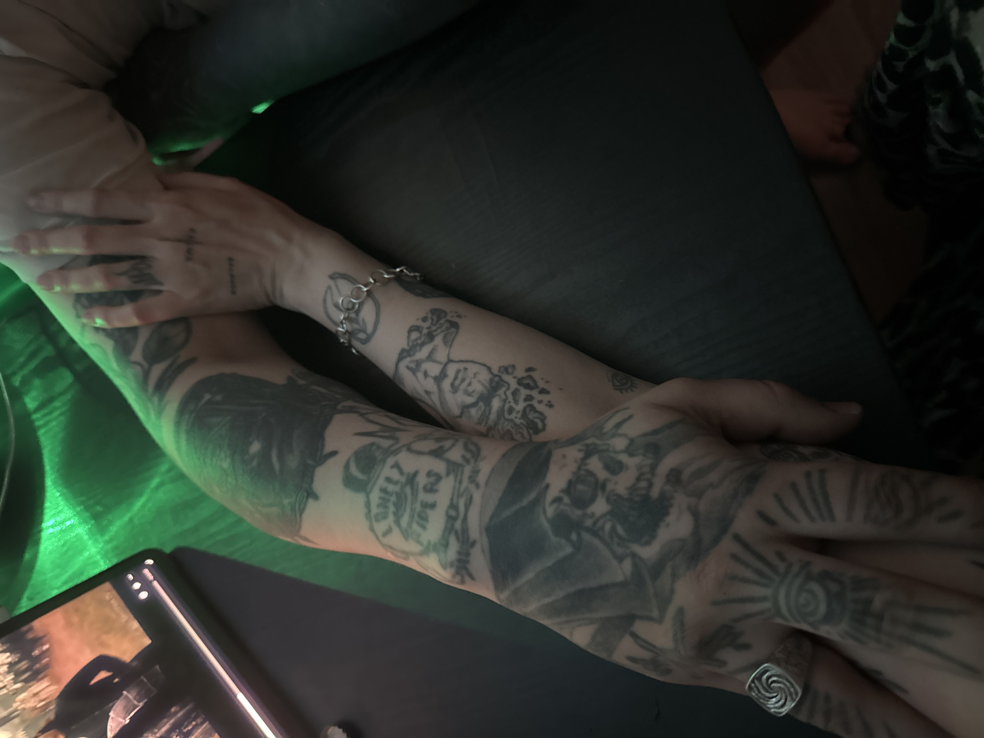Tattooed hands, green crystal light, and LED-lit curtains in Moscow
