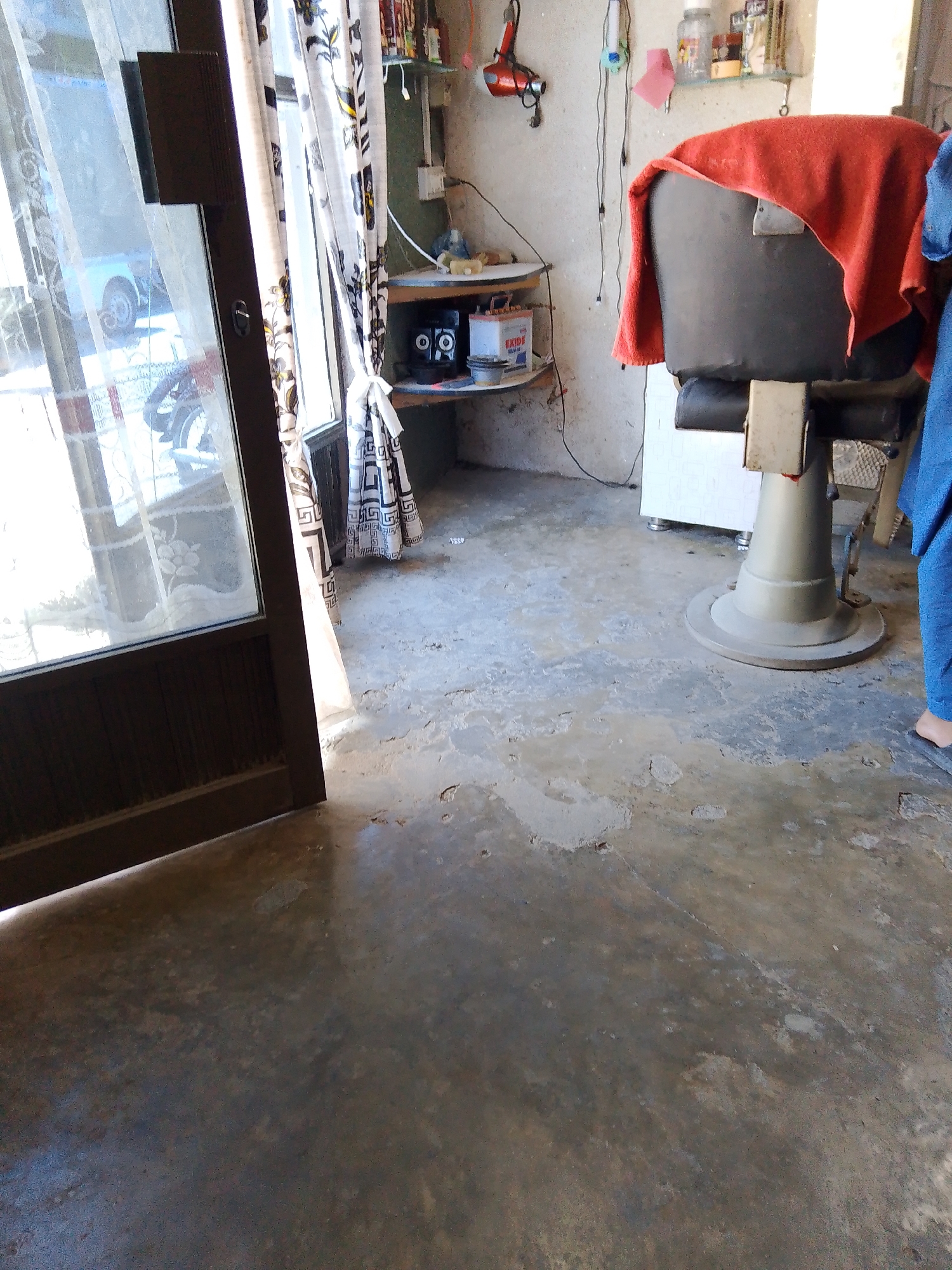 Inside a Mansehra barbershop and nearby home, ground level