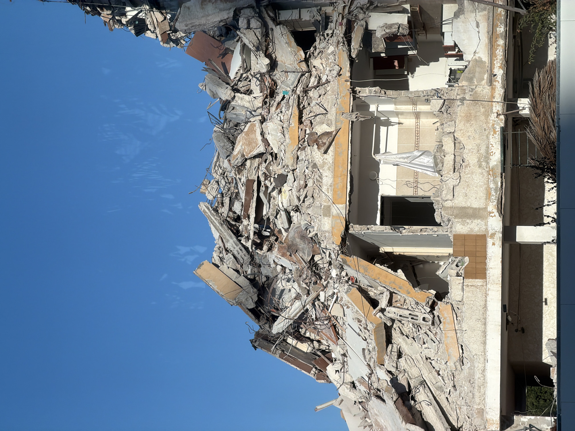 Building collapse and street-level scenes from Tel Aviv