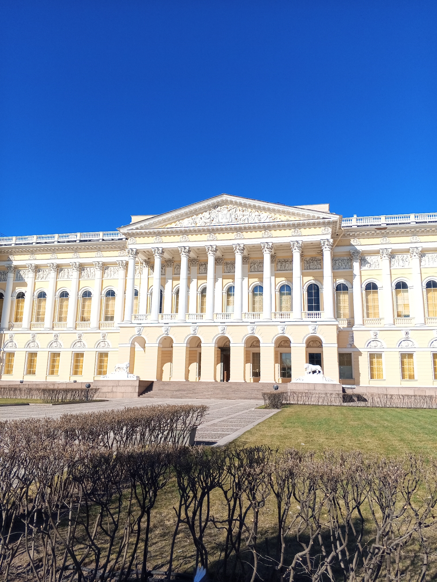 Visitors document ornate interiors at Saint Petersburg's Russian Museum