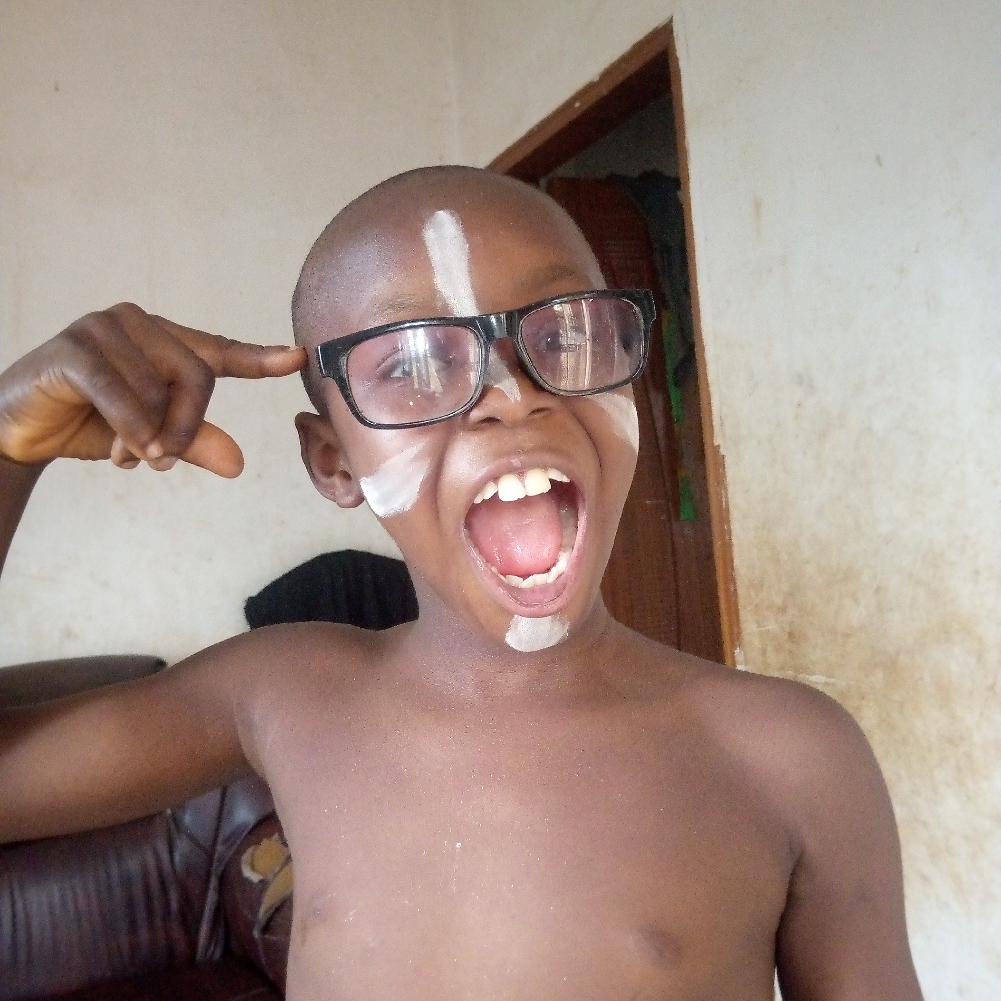 Child's face-painting session documented in seven indoor memories