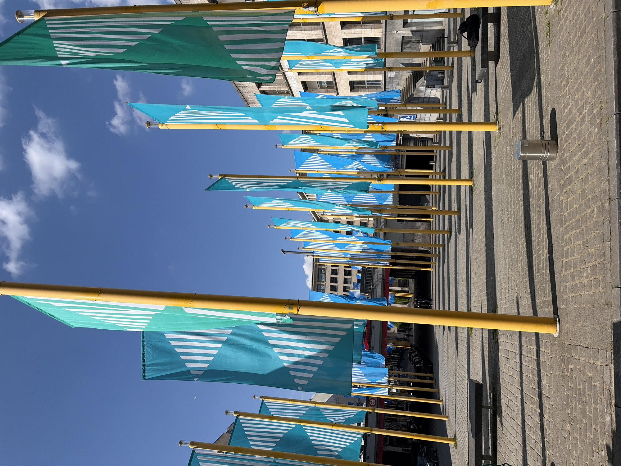 Brussels street scenes captured showing decorative flags and ornate buildings
