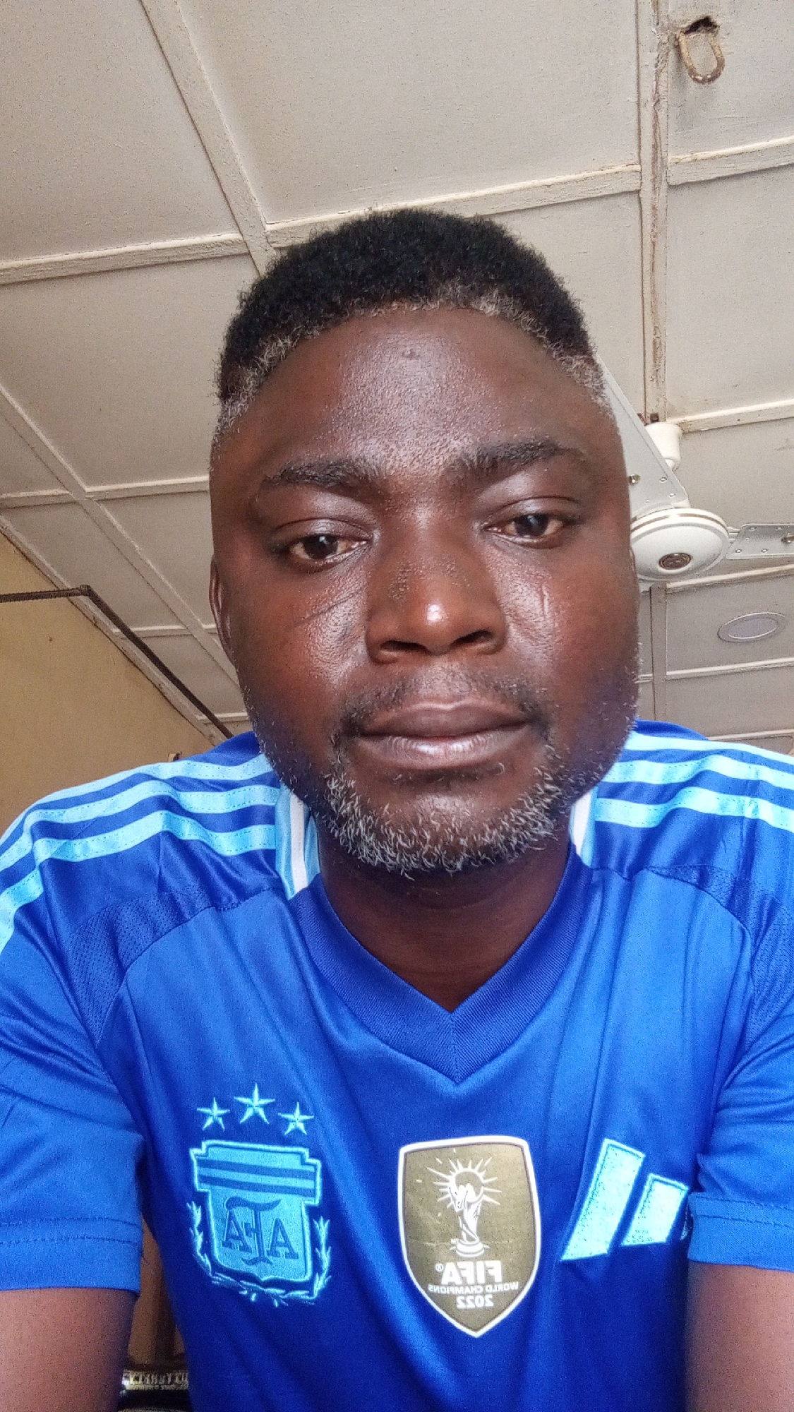 Man in Argentina jersey photographed repeatedly in Nigerian neighborhood