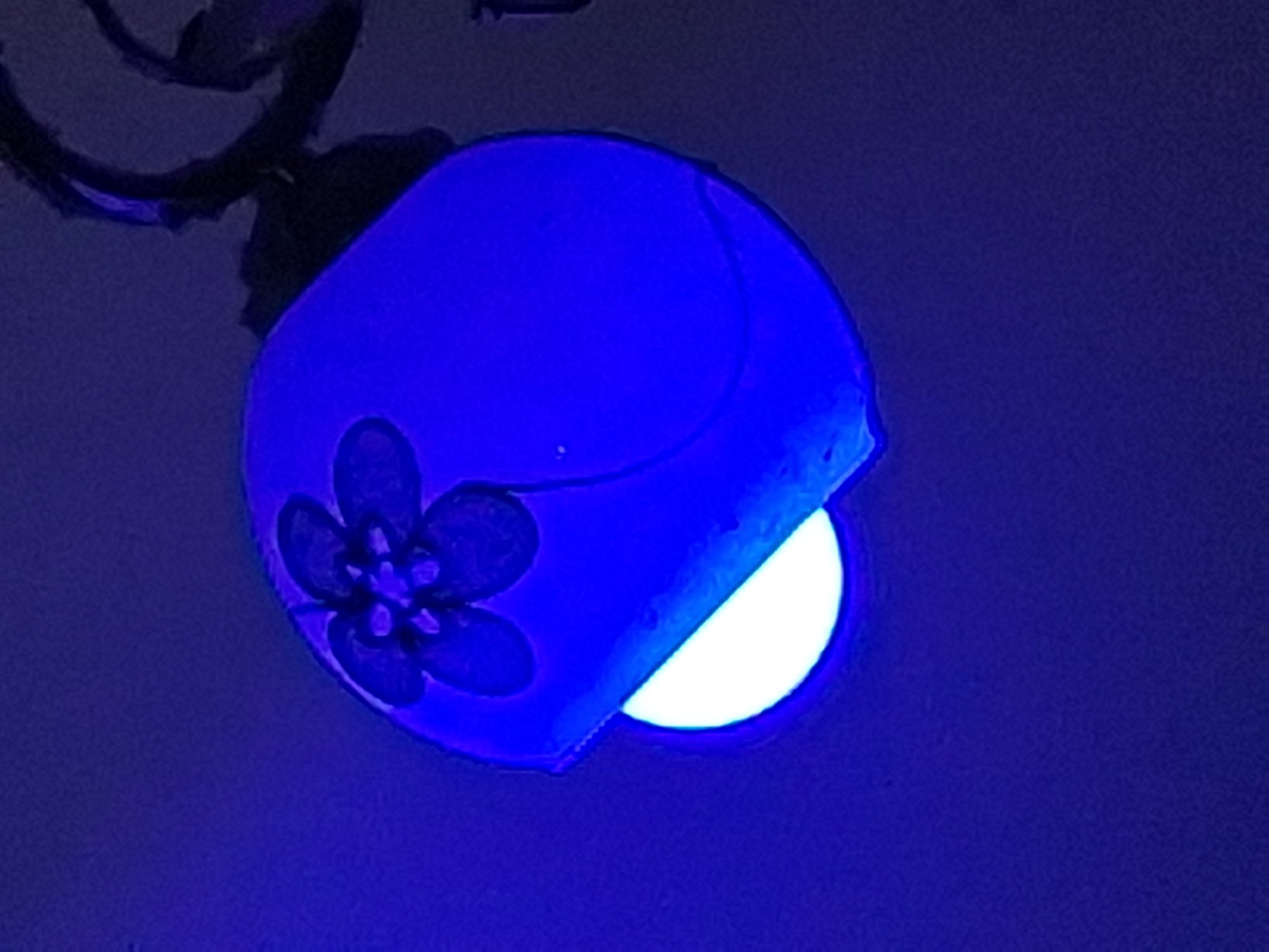 Blue-lit indoor scenes captured in Varna show lamp and tattoo