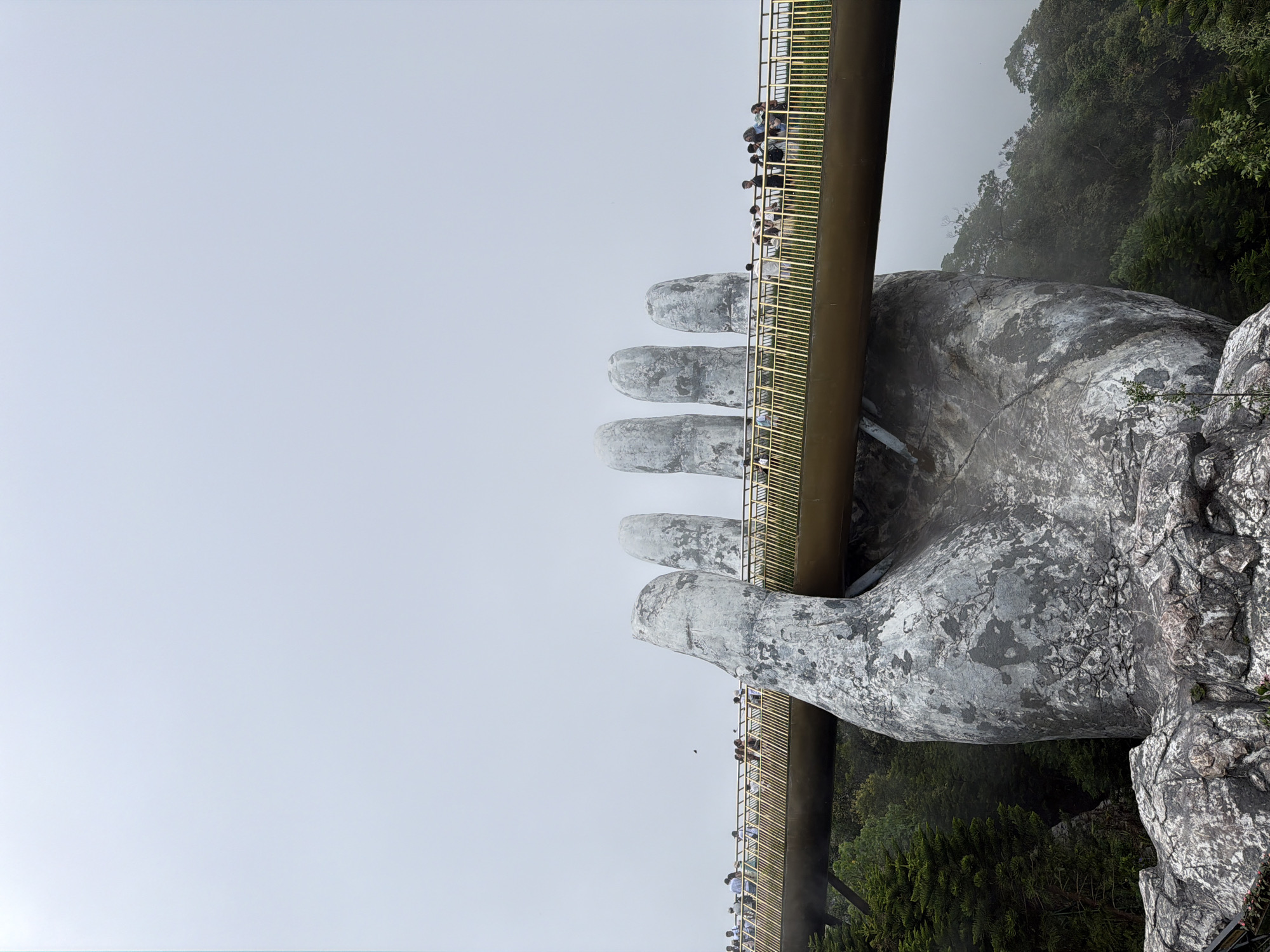 Morning tourists visit Vietnam's famous Golden Bridge attraction