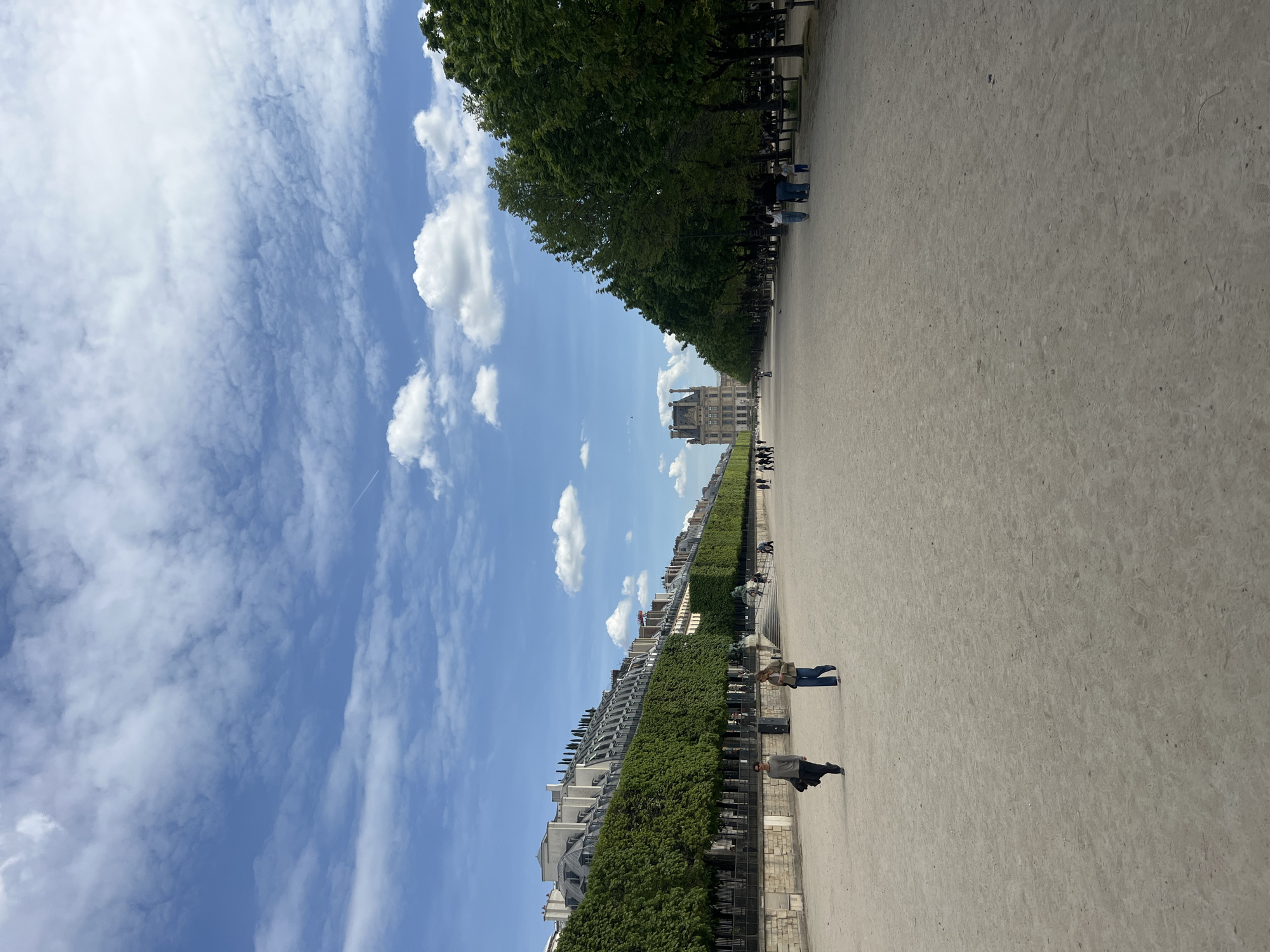 Woman takes selfie in Tuileries Garden near Louvre
