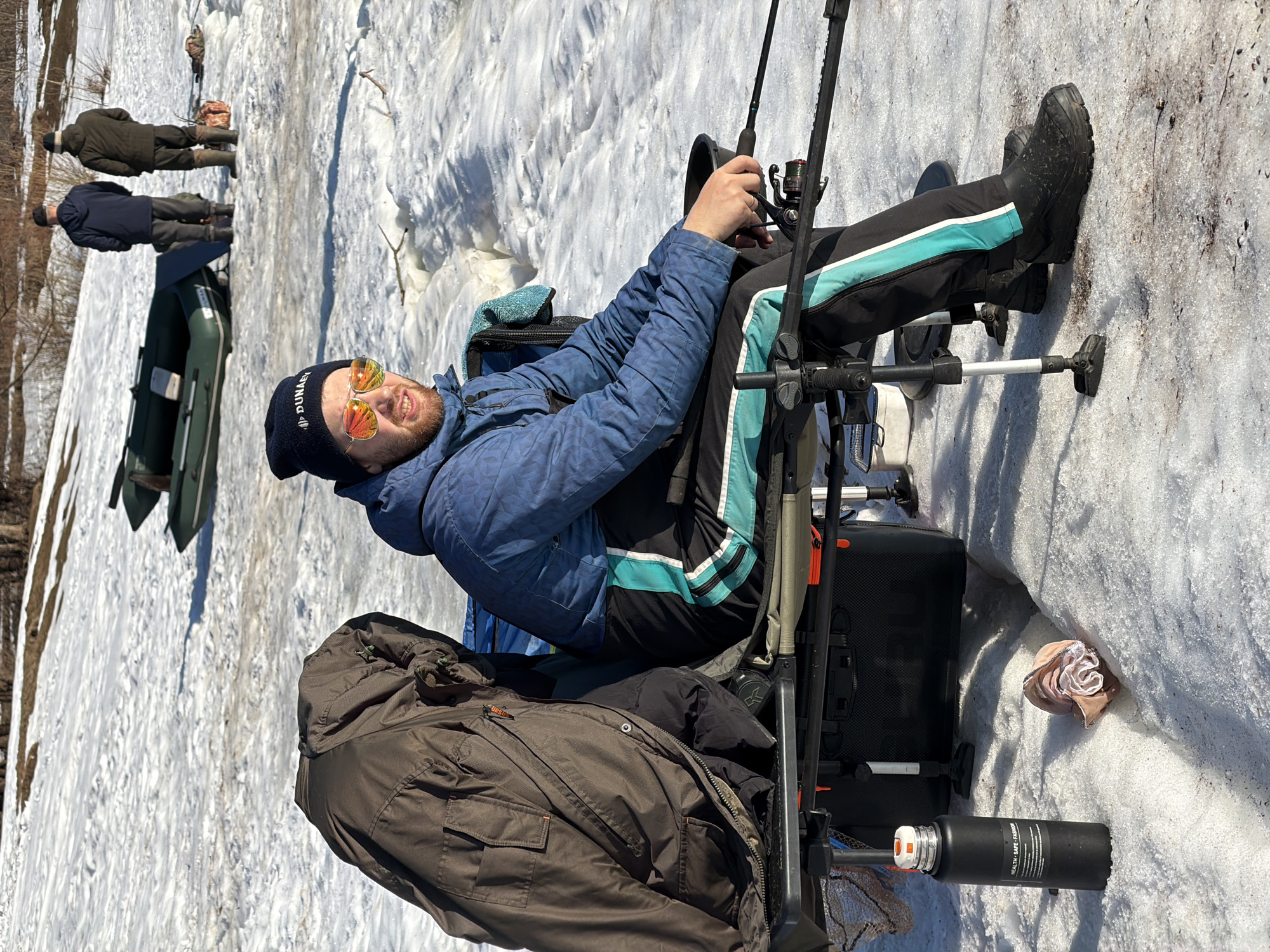 Ice fisherman captured on snowy surface in Chaikovsky