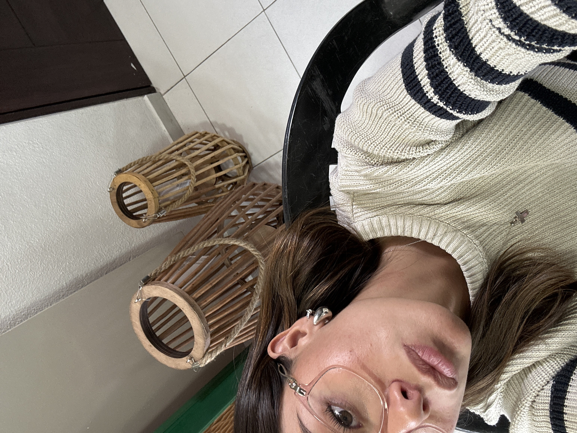 Person in striped sweater photographed from multiple angles indoors