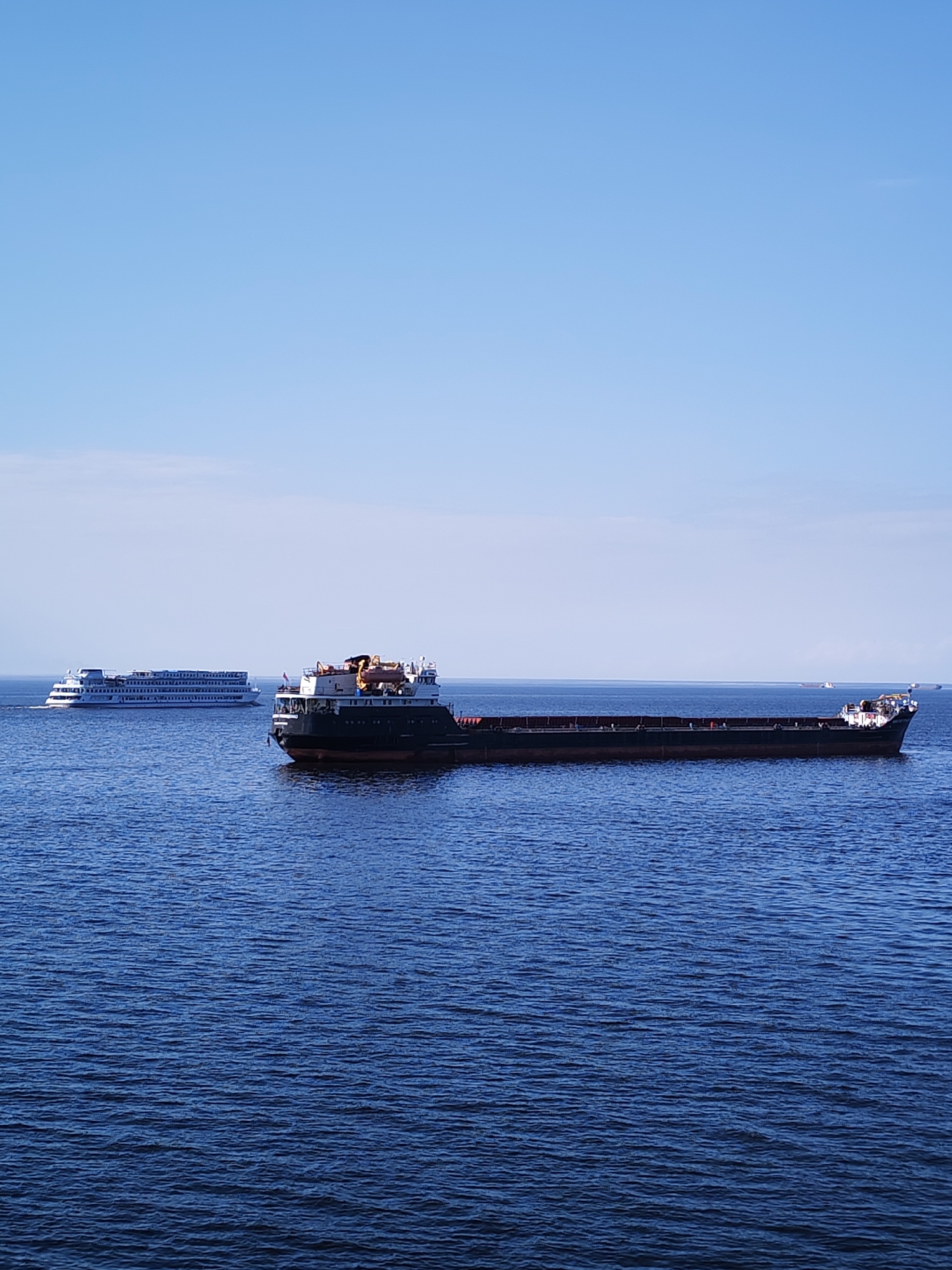 Empty cargo ship spotted on reflective waters