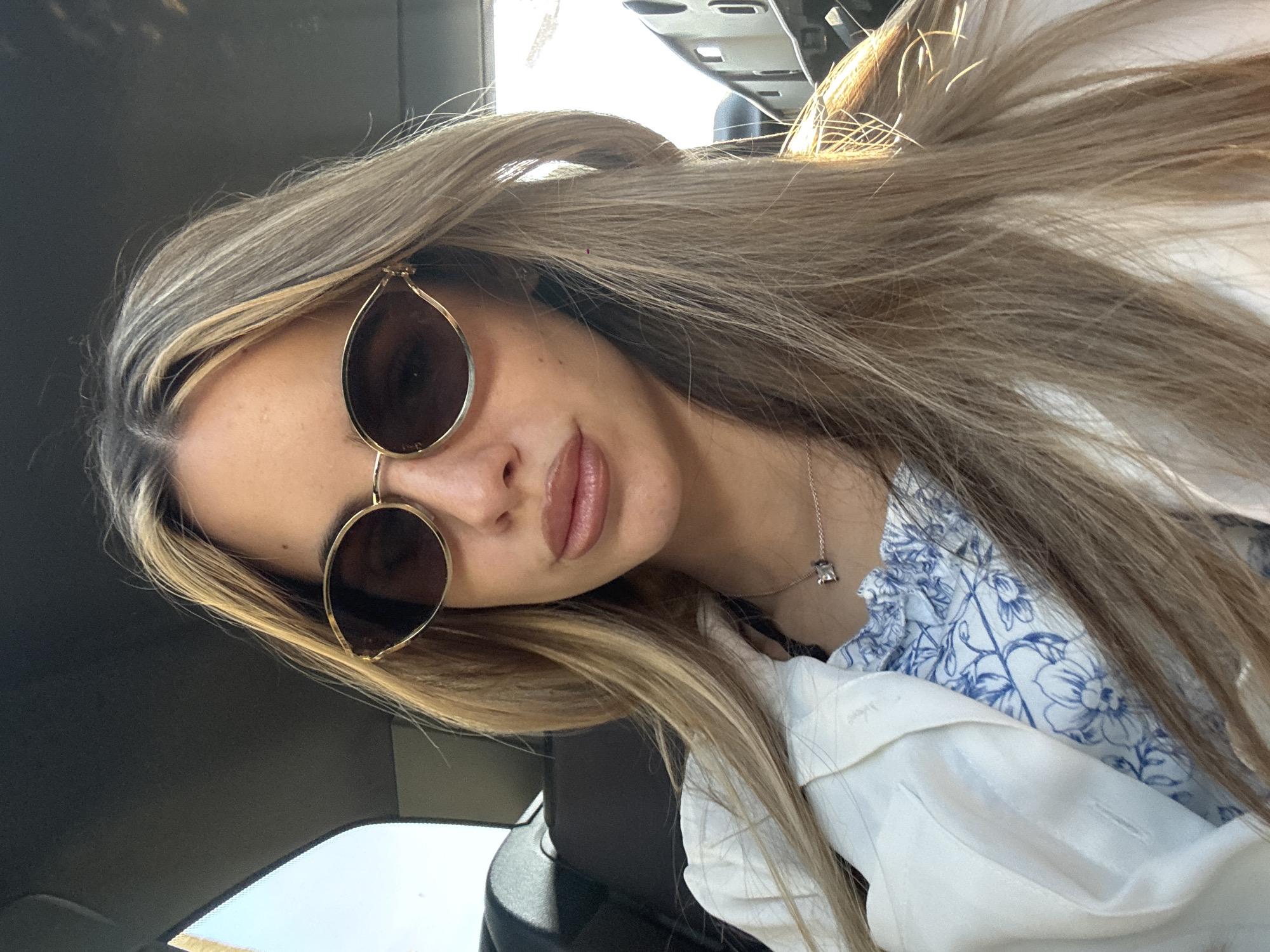 Woman in sunglasses observed in vehicle in Strumyani, Bulgaria