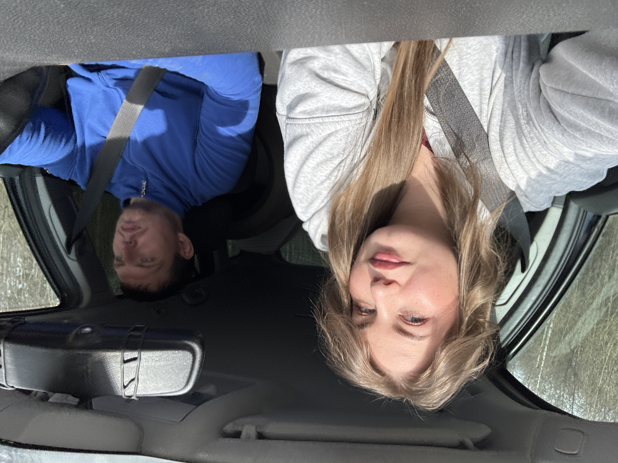 Young woman photographed as passenger in vehicle, Russia
