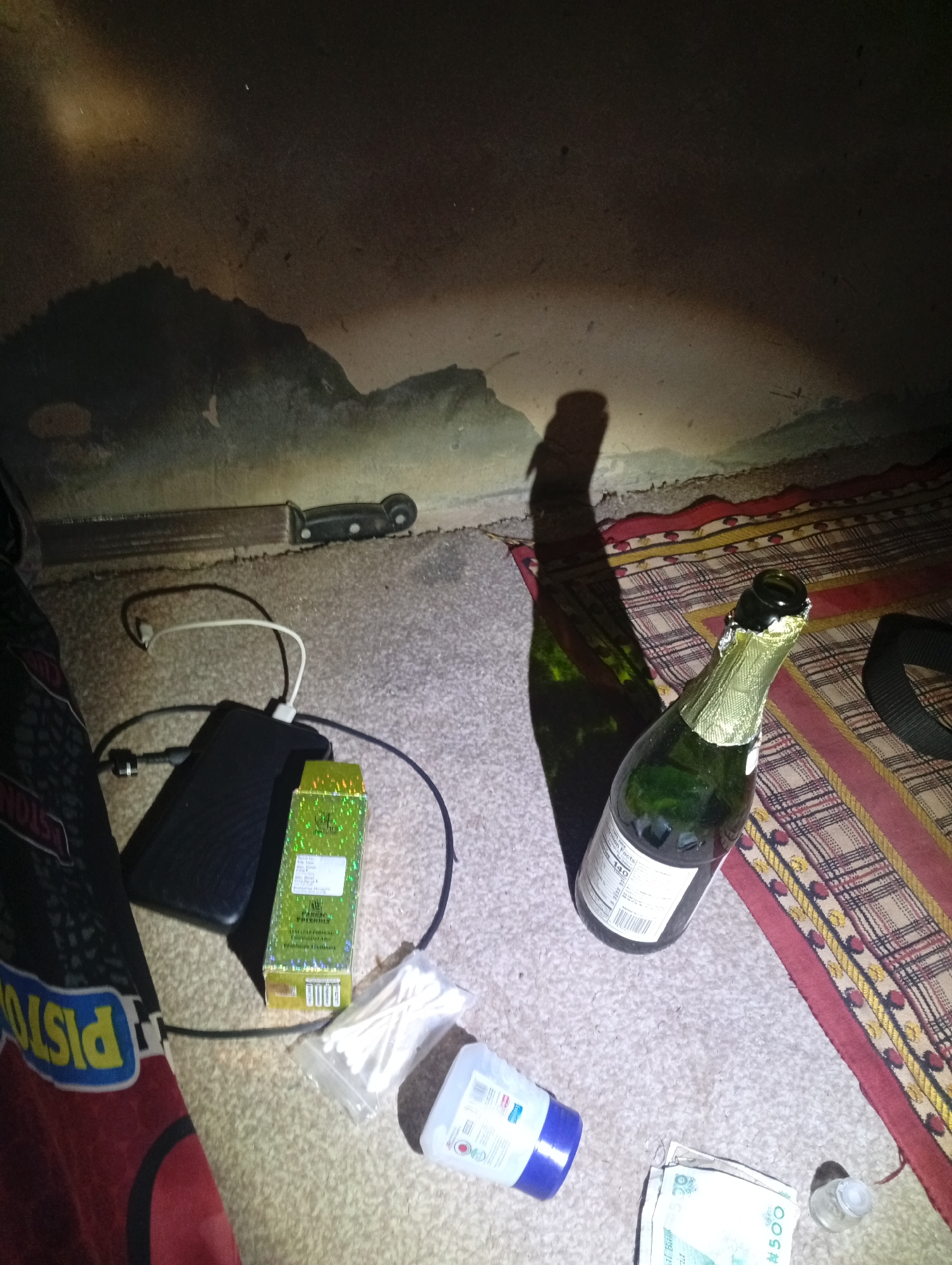 Objects scattered on floor documented in Rigasa home