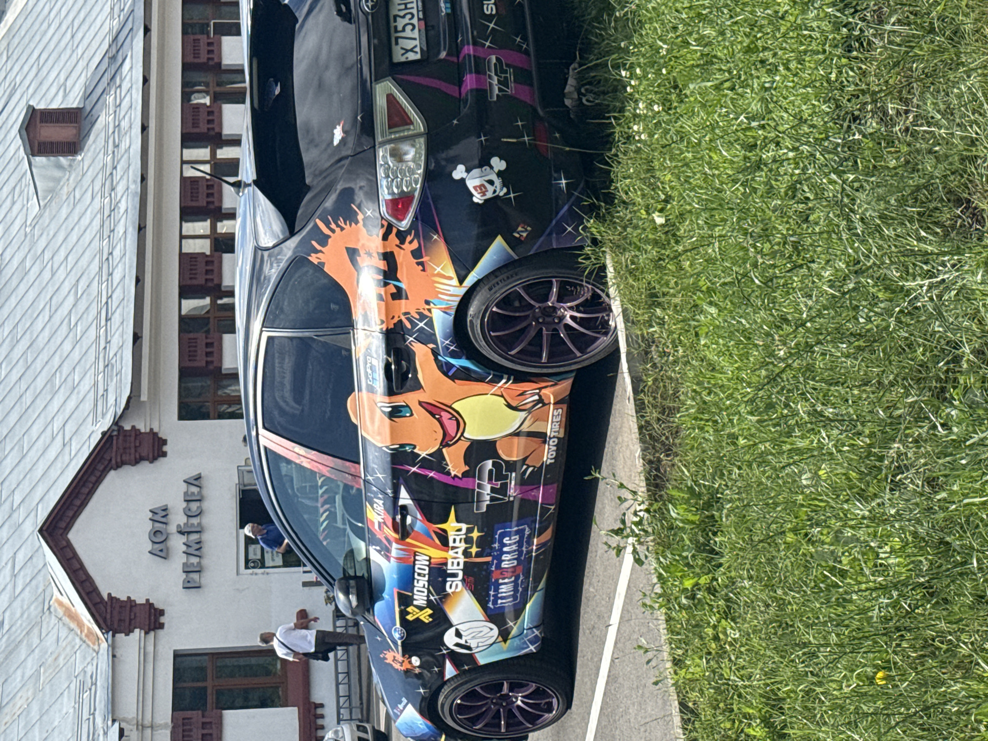 Moscow comic and collectibles shop, plus a cartoon-wrapped Subaru outside