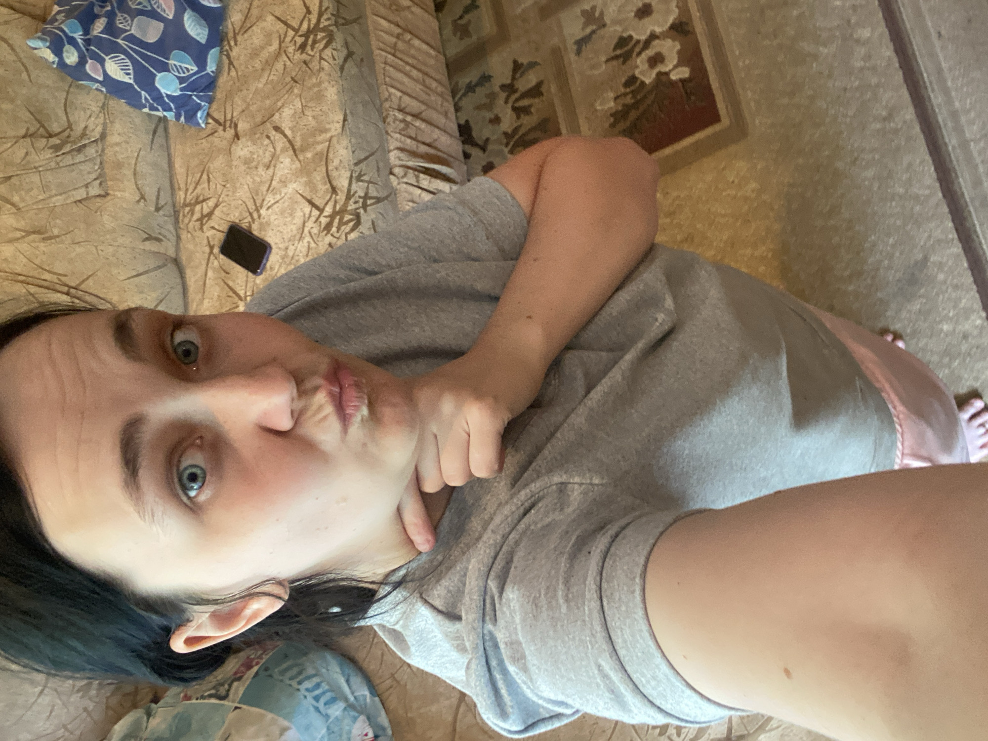 Relaxed indoor selfie session on the sofa