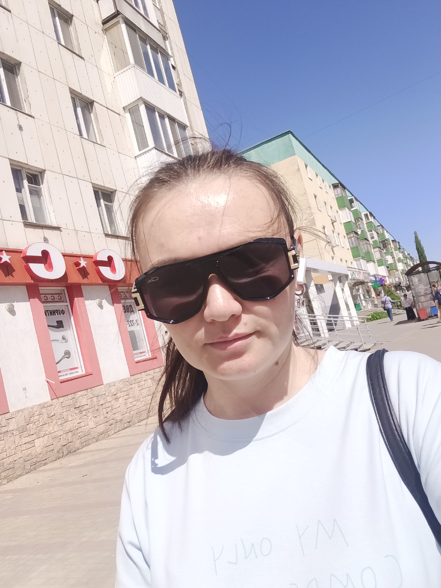 Woman takes selfie on street in Ufa, Russia