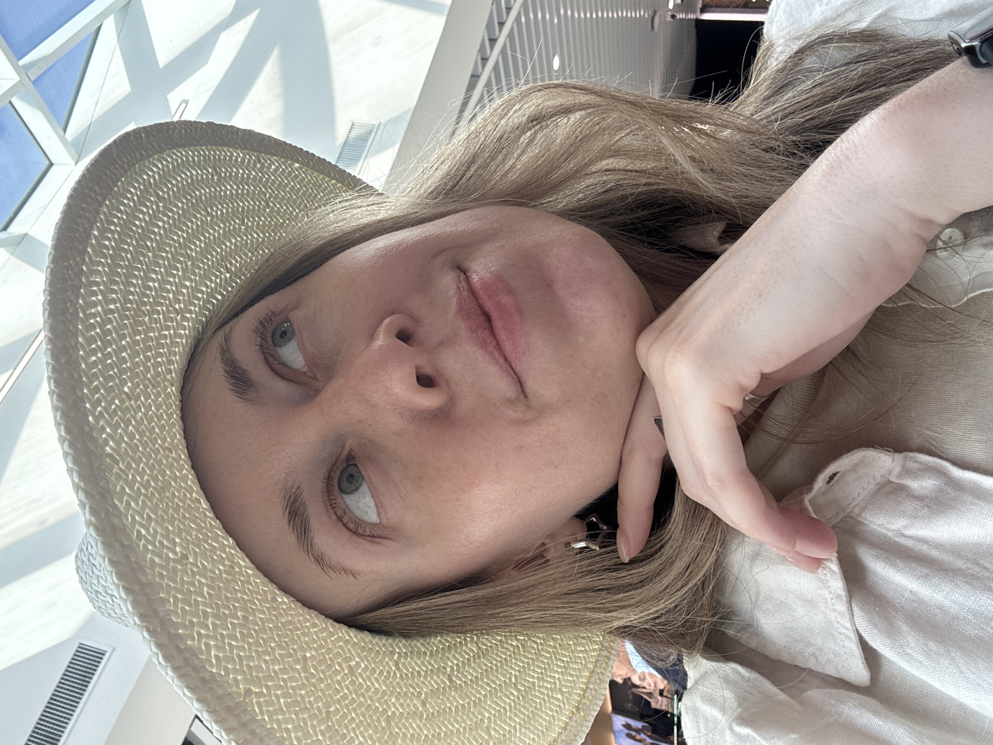 Selfie moment under geometric skylight at Fiumicino Airport