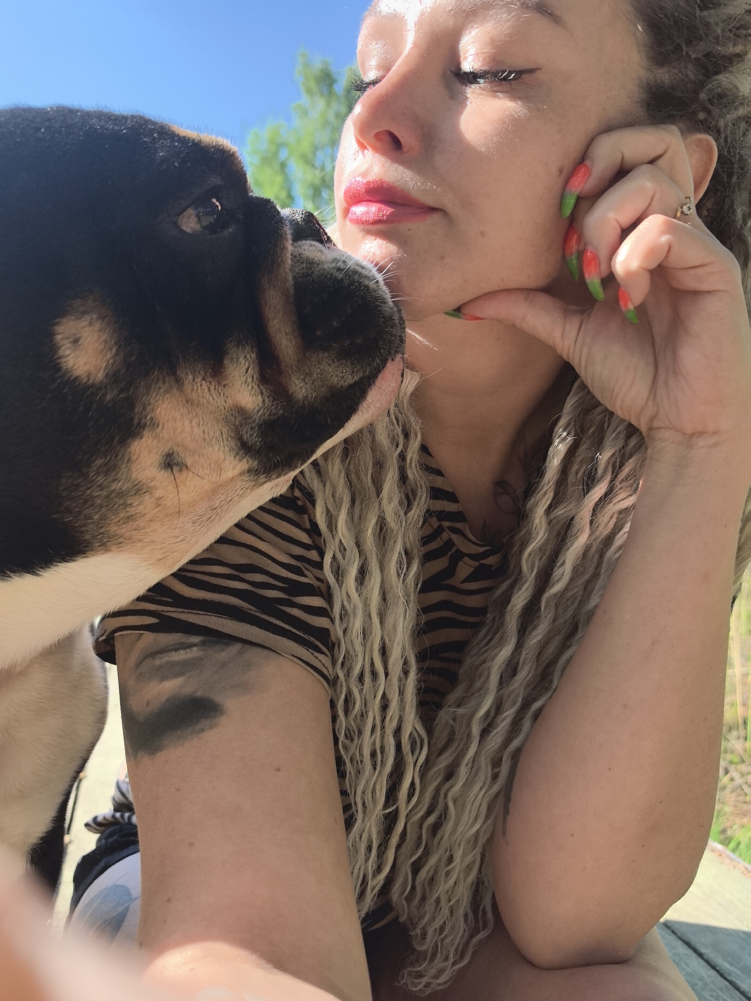 Woman enjoys leisurely afternoon with bulldog on Russian pier