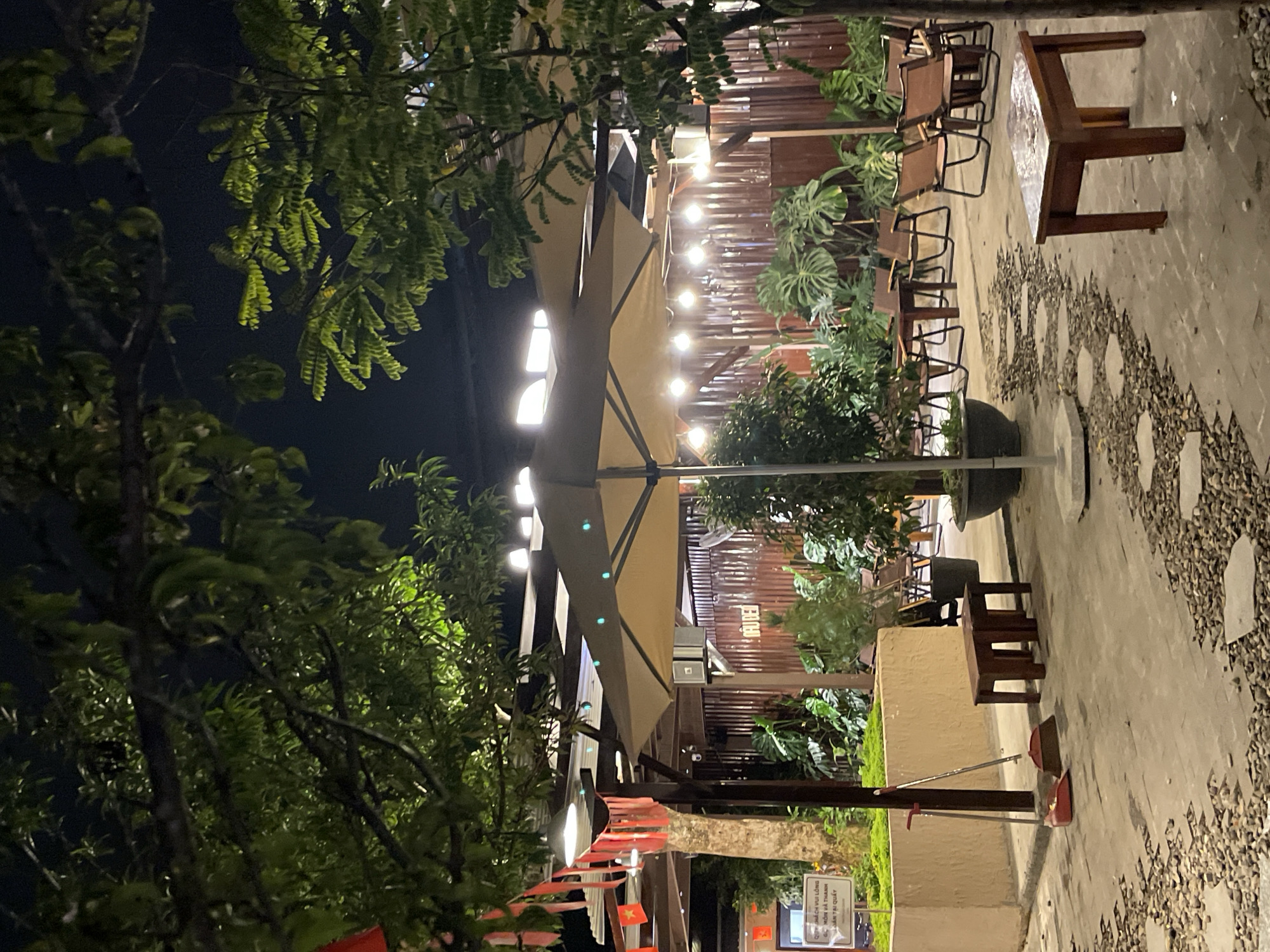 Evening at illuminated outdoor cafe in Đà Lạt