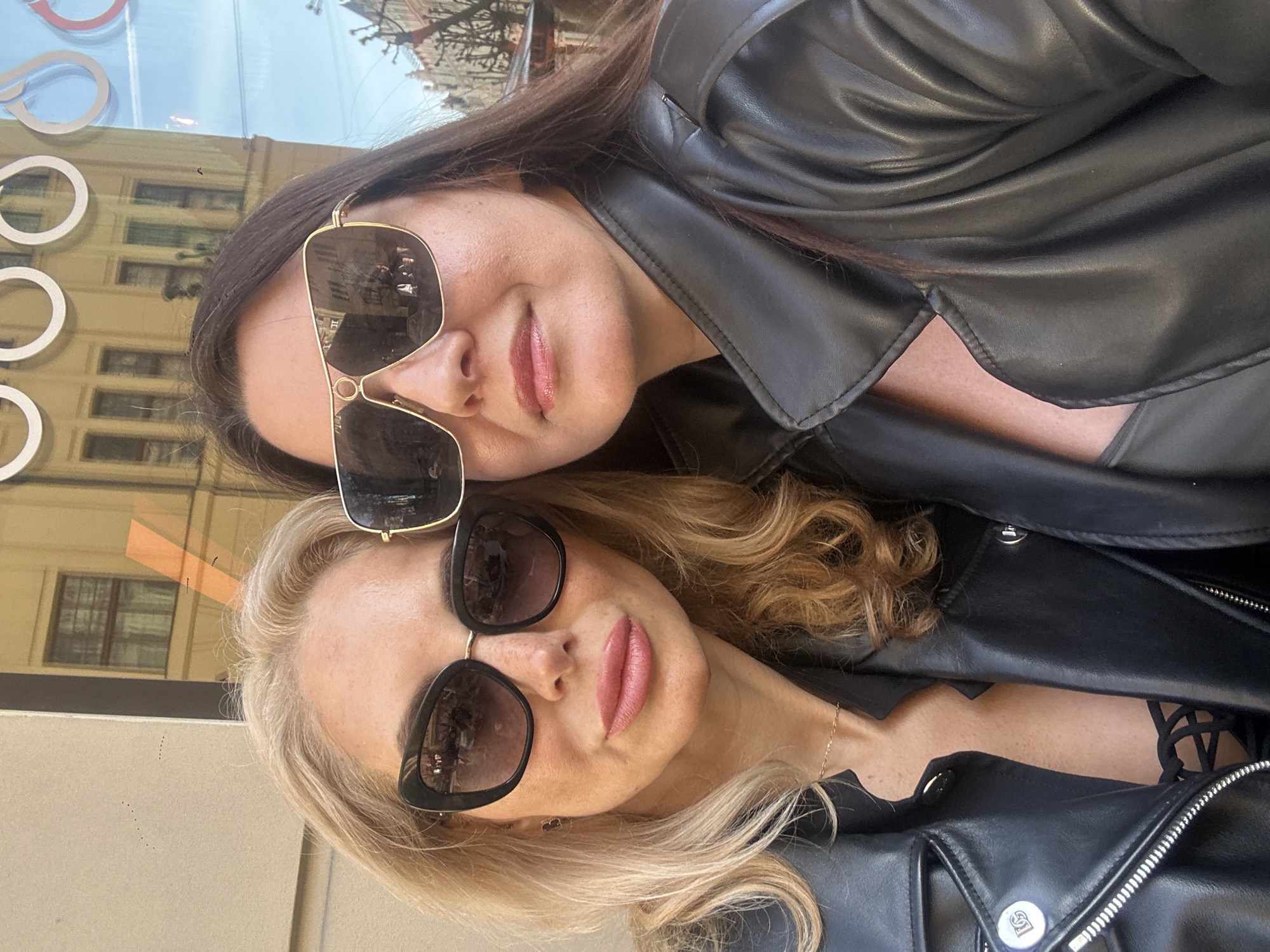 Friends enjoy sunny afternoon cafe session in Riga