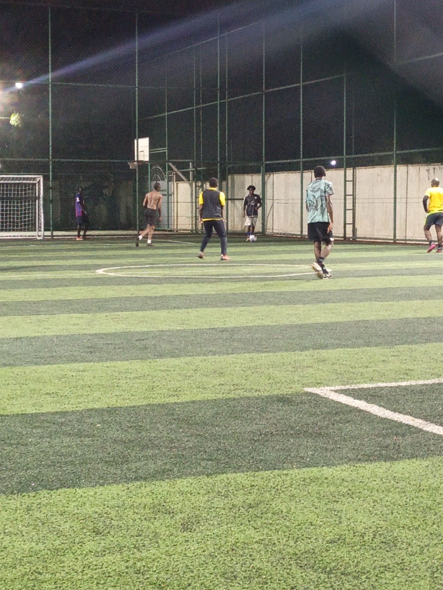 Evening soccer match played on artificial turf in Nairobi