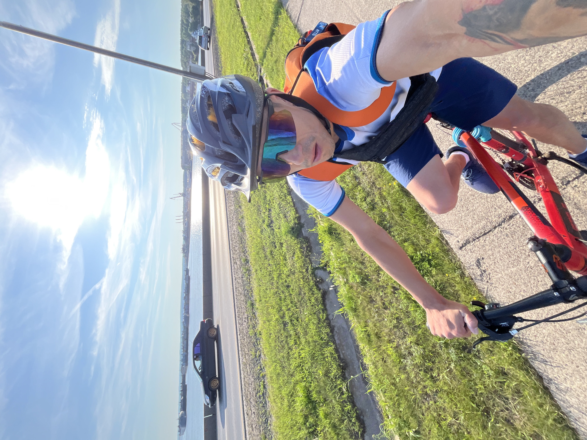 Red bicycle ride through Chaikovsky on a sunny summer day