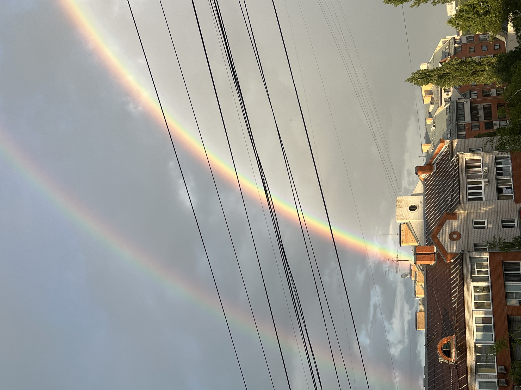 Double rainbow over Zhukovsky rooftops after summer rain