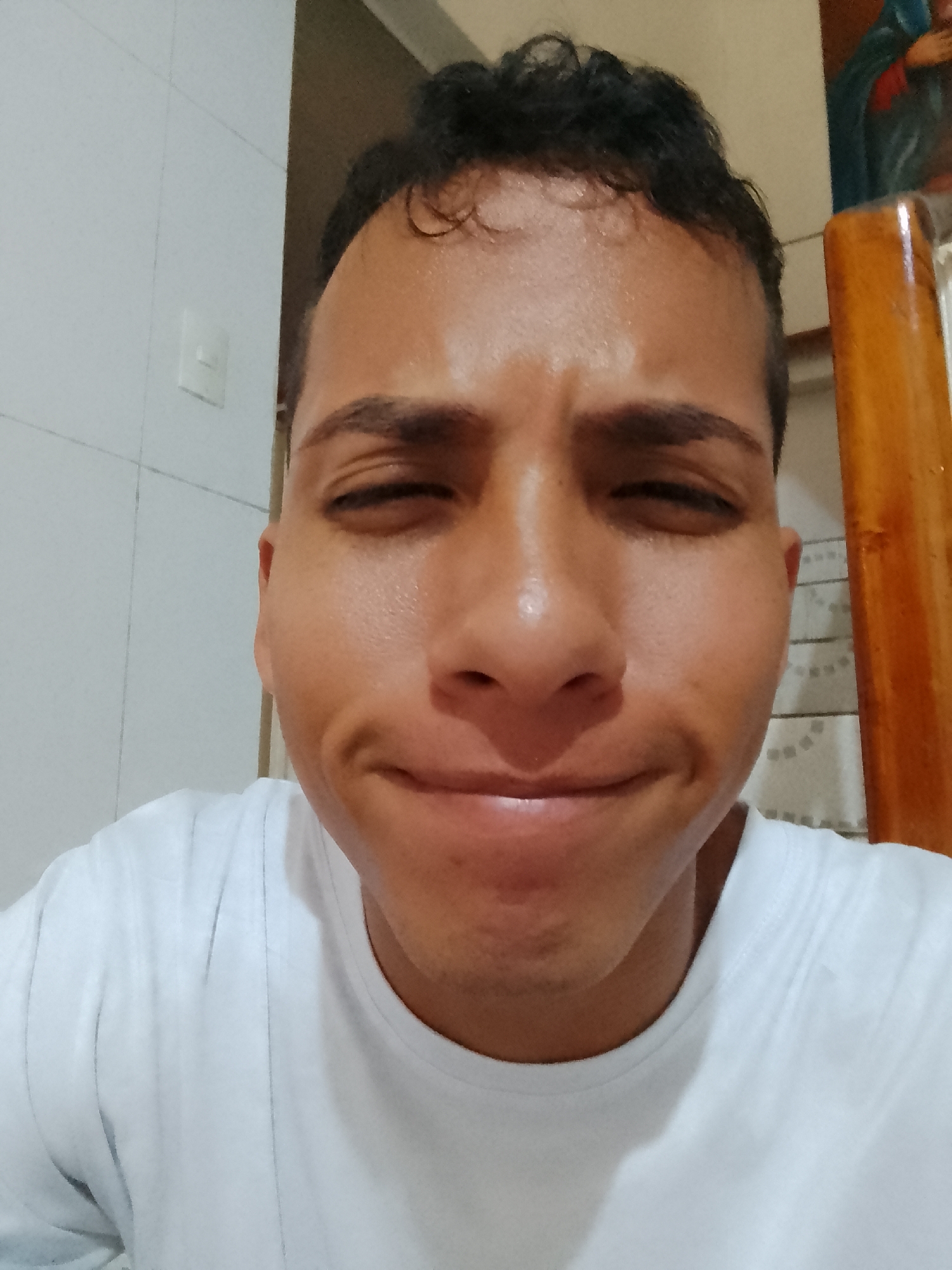 Young man takes selfies with dog in Pampatar home
