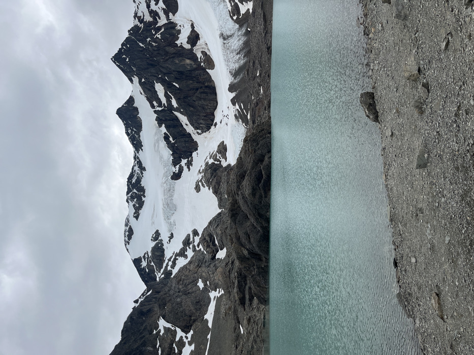 Snow-capped mountains and still waters photographed in Ushuaia