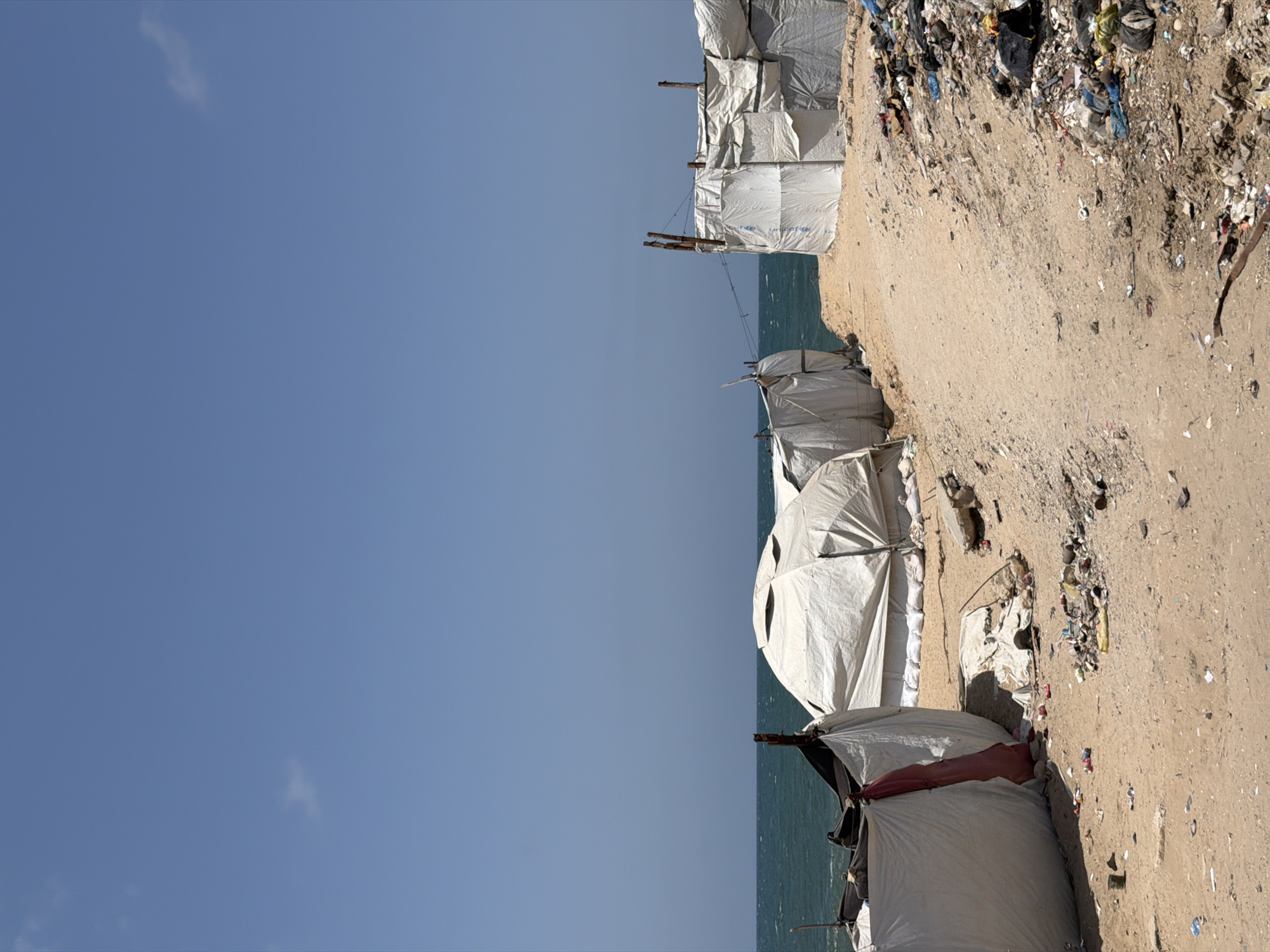Temporary shelters observed along Gaza coast housing displaced persons