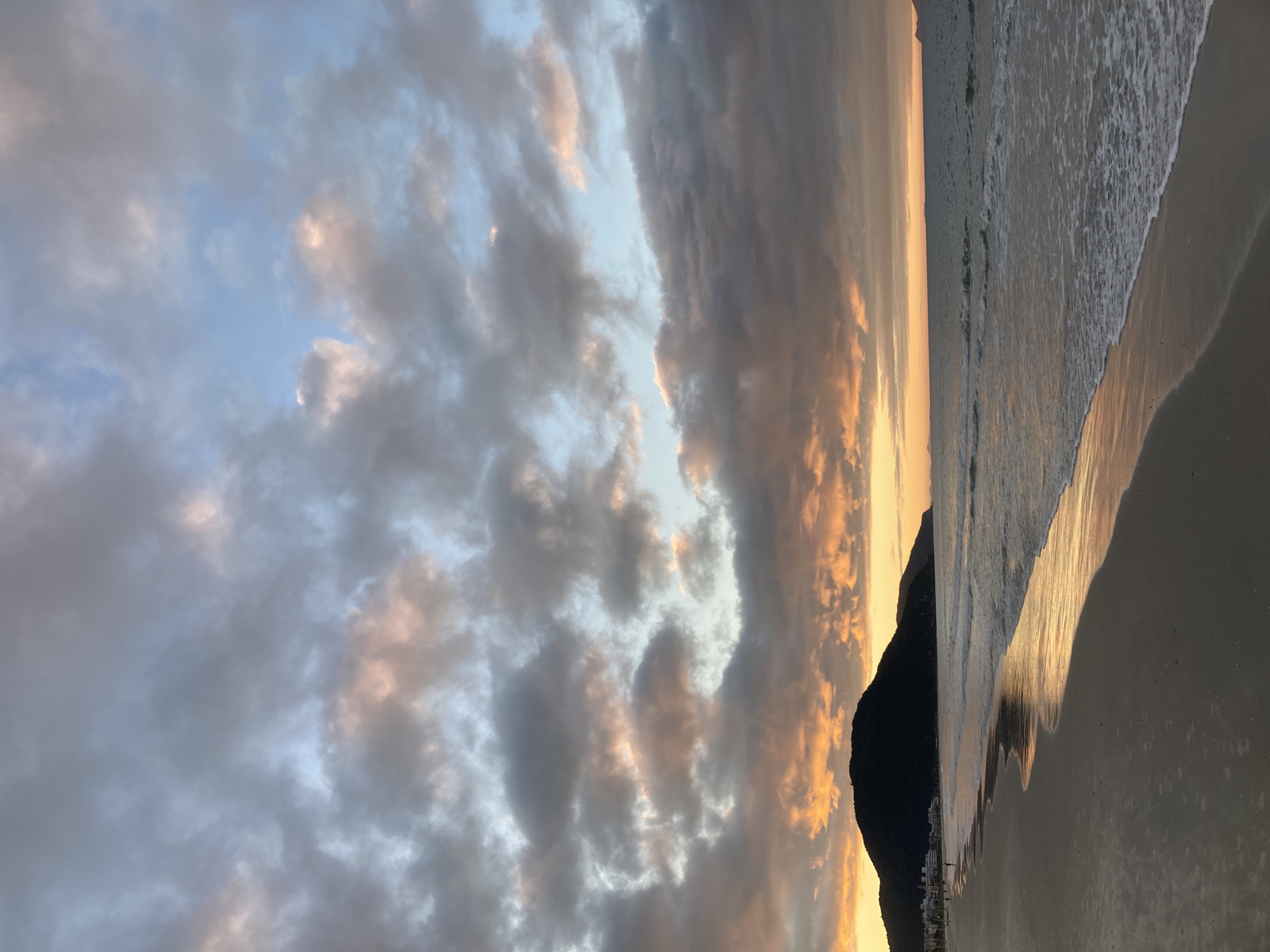 Golden hour clouds over a Florianópolis beach