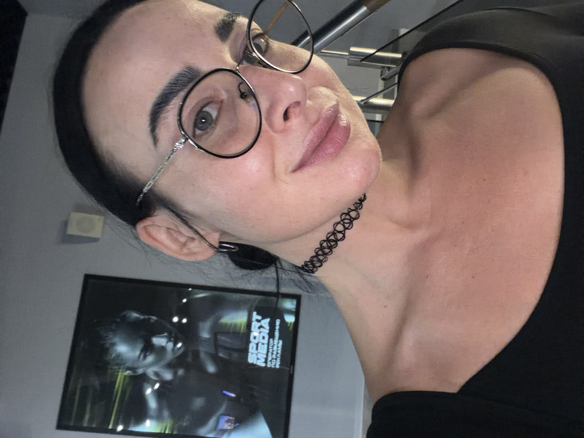 Woman takes selfies indoors in Saint Petersburg apartment