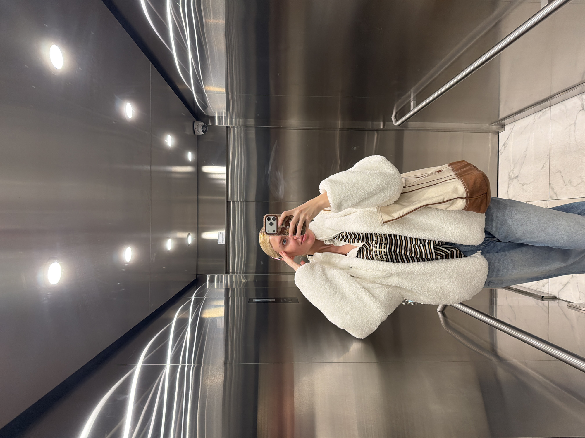 Woman takes selfie in Belgrade elevator