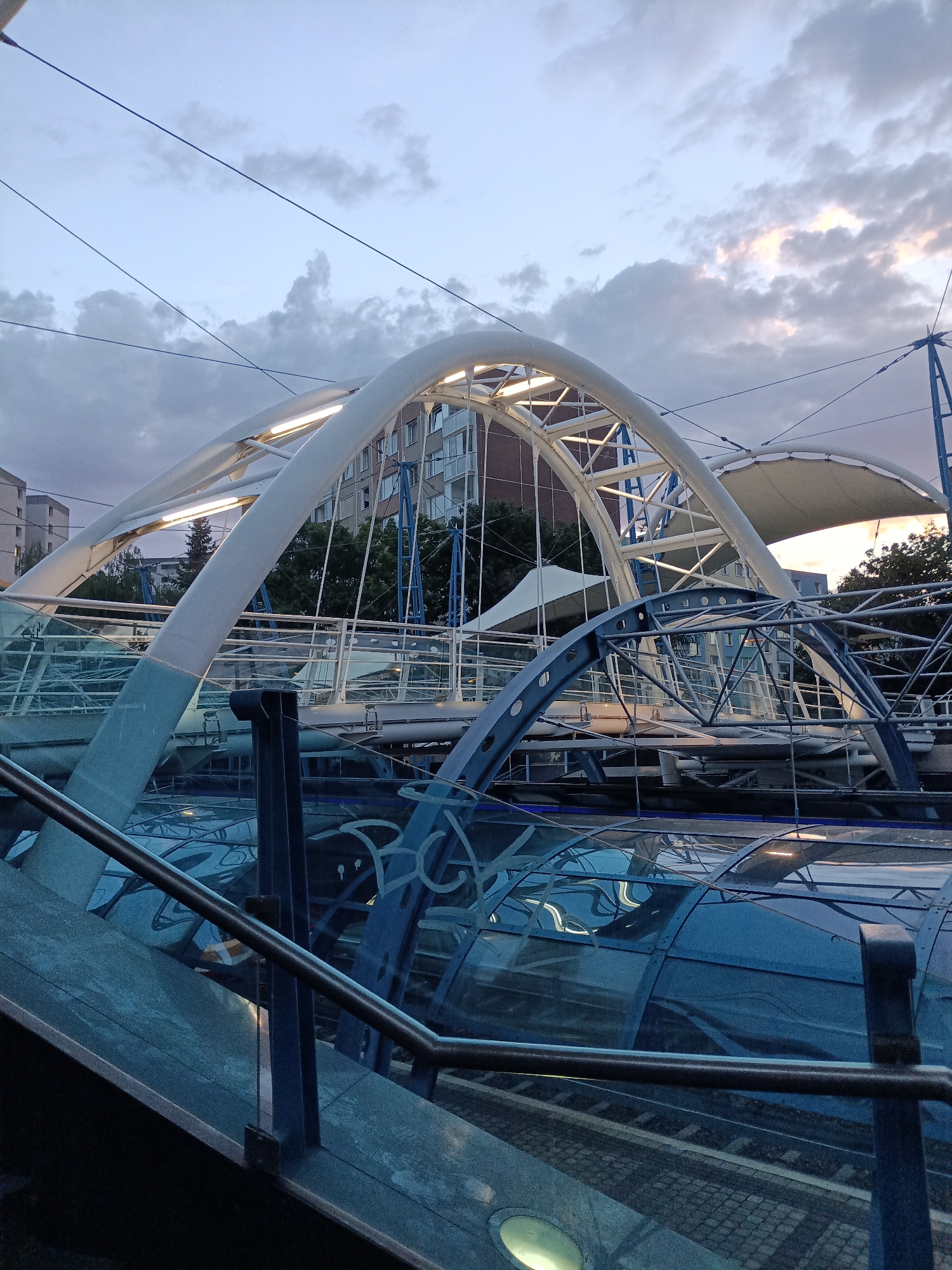 Prague transit hubs and modern infrastructure, August evening