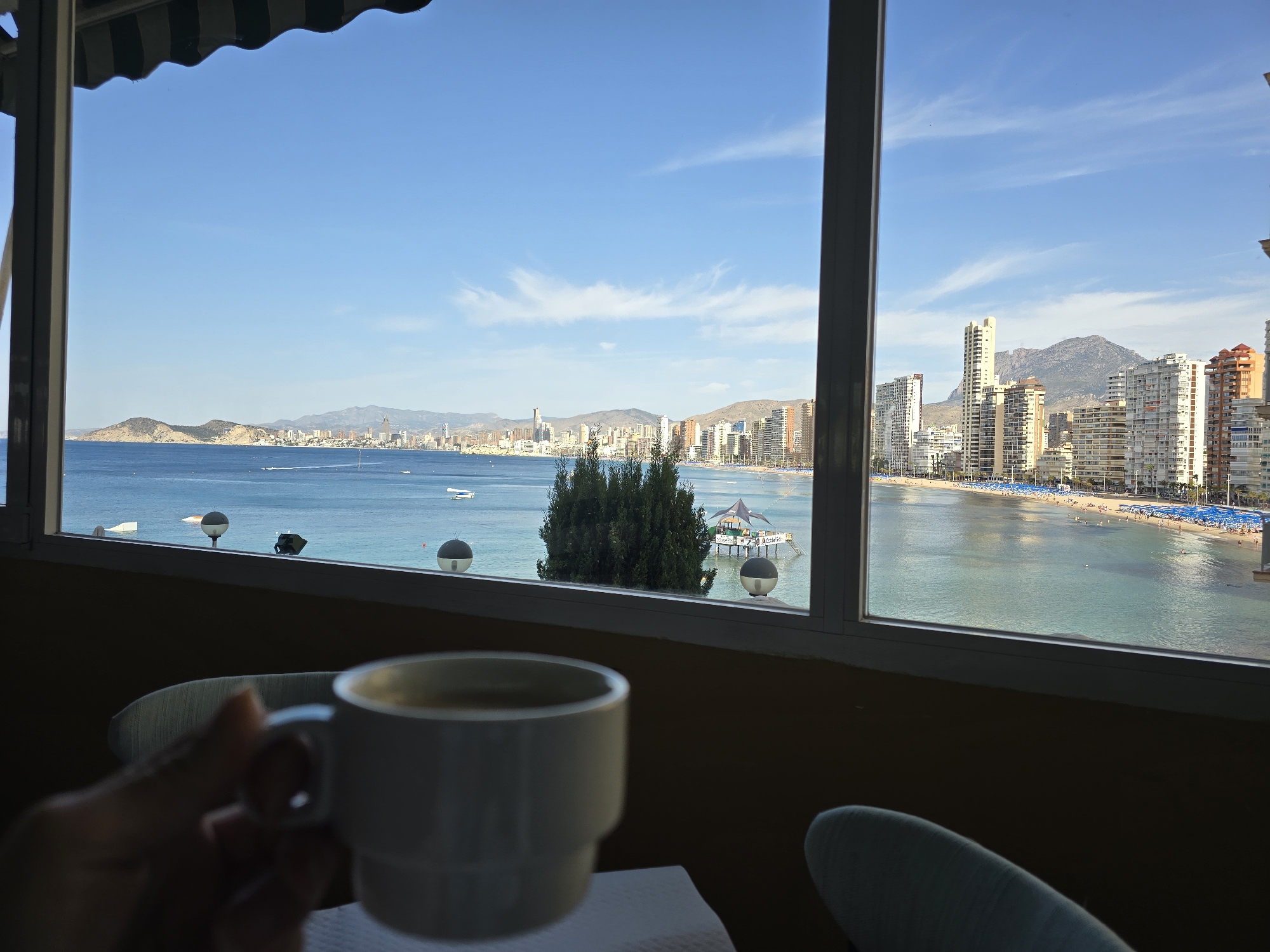Tourist captures morning views of sunny Benidorm coastline
