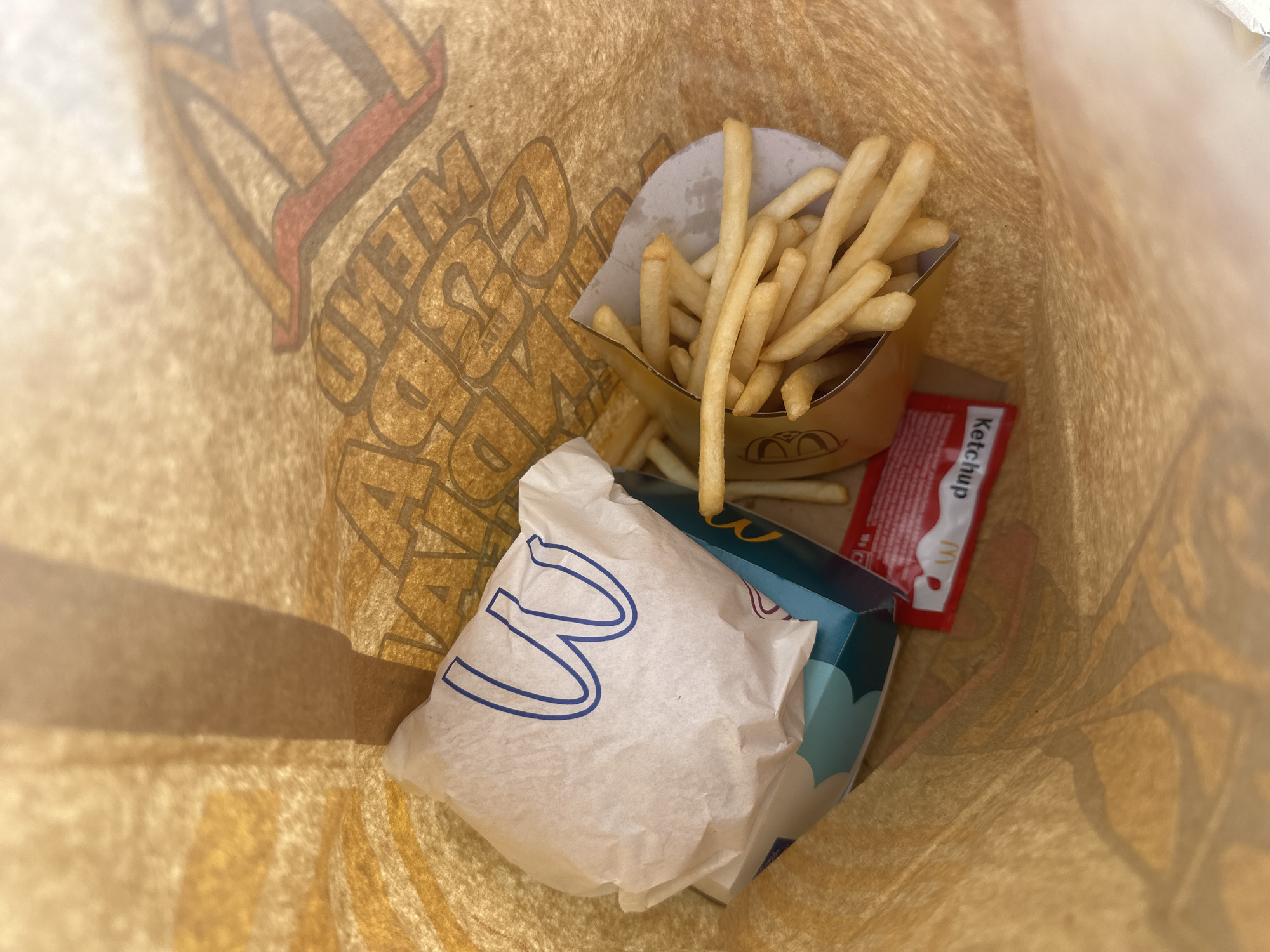 McDonald's meal unpacked at outdoor terrace in Alicante