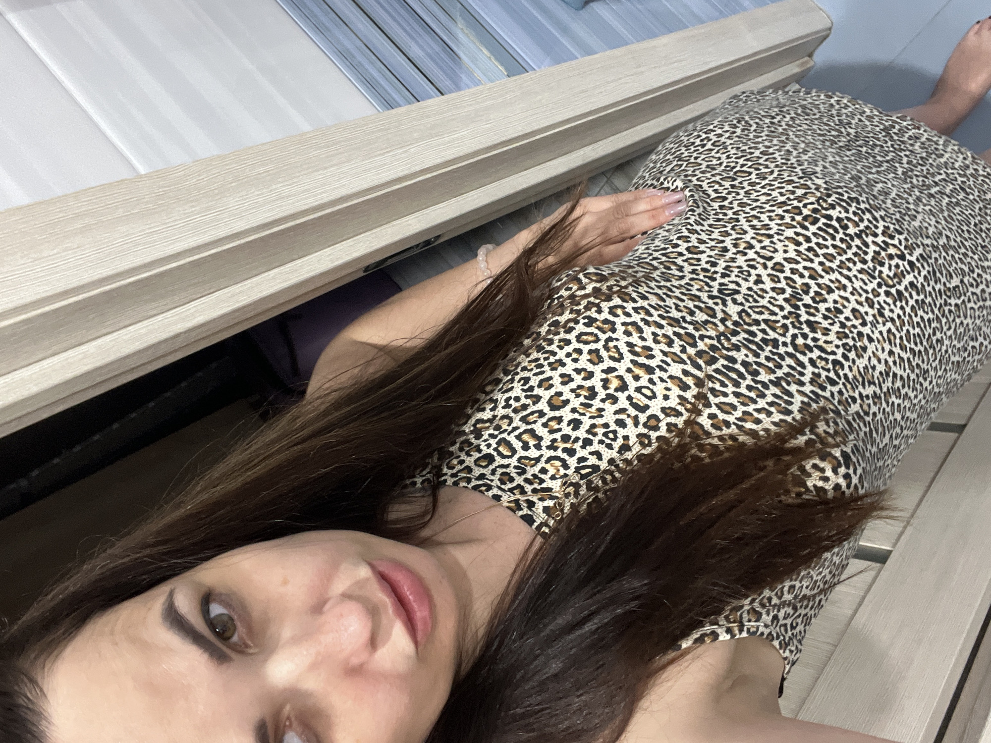 Bathroom photoshoot session with leopard-print outfit and multiple poses