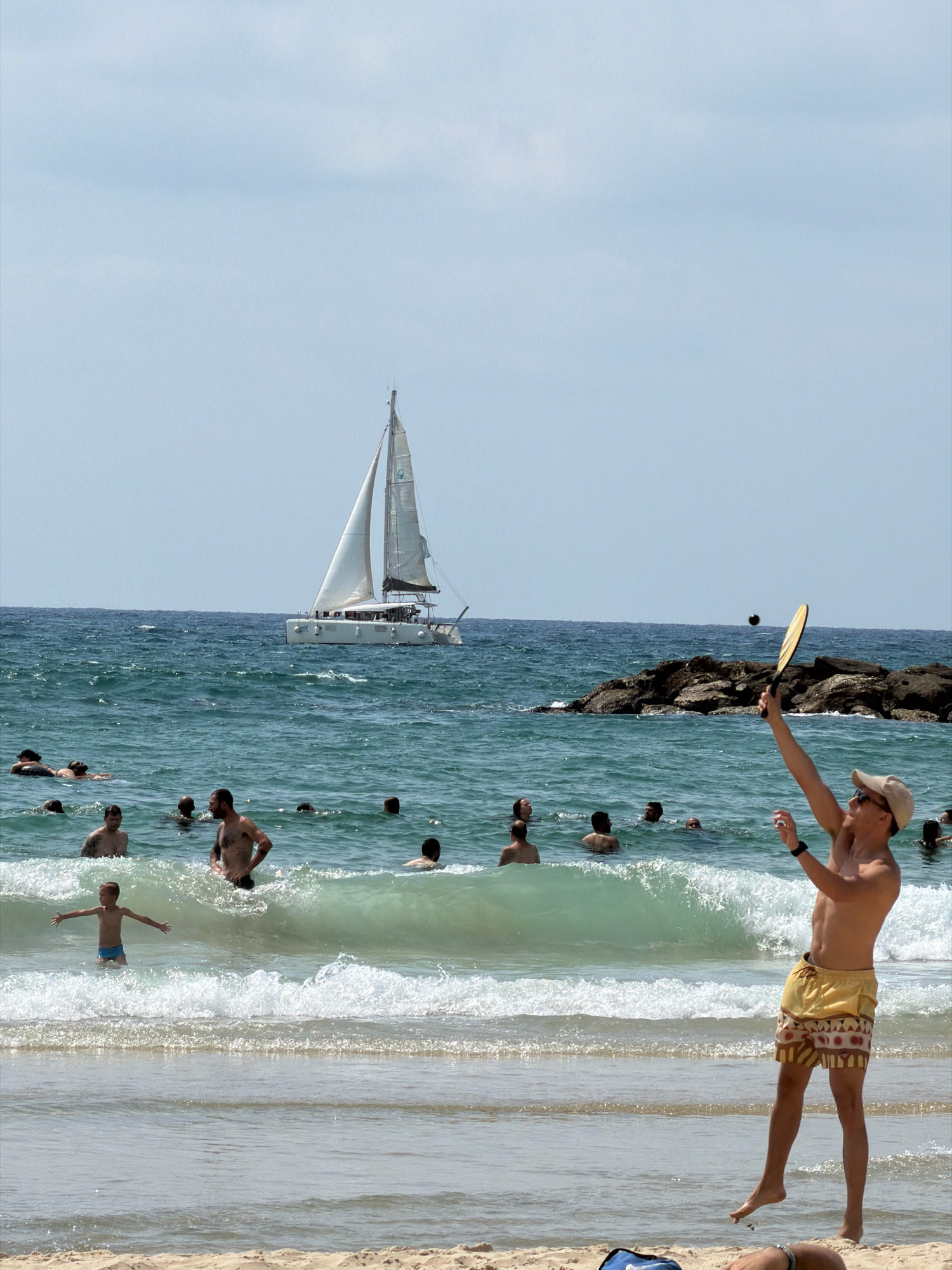 Crowded Tel Aviv beach on a sunny summer morning