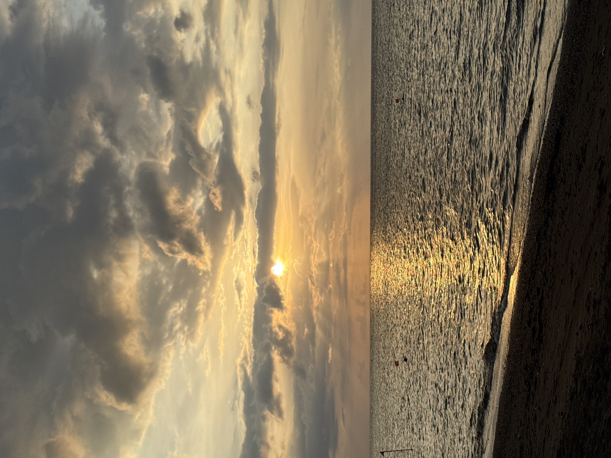 Sunset observed at Buleleng beach with golden water reflections