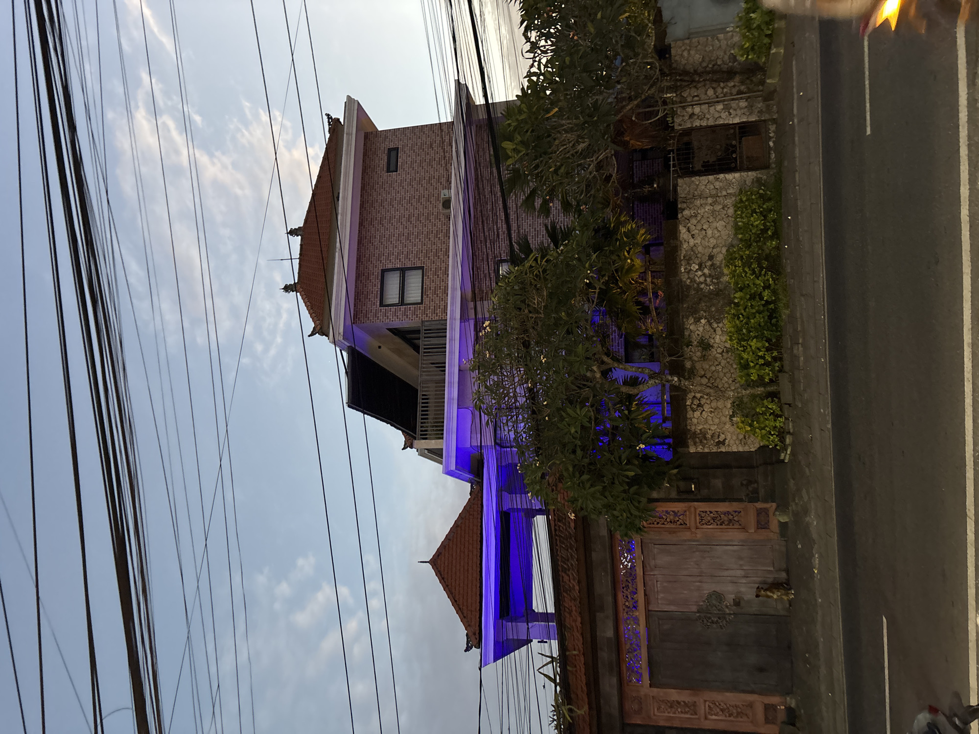 Blue-lit brick building observed in Kuta Selatan, Indonesia