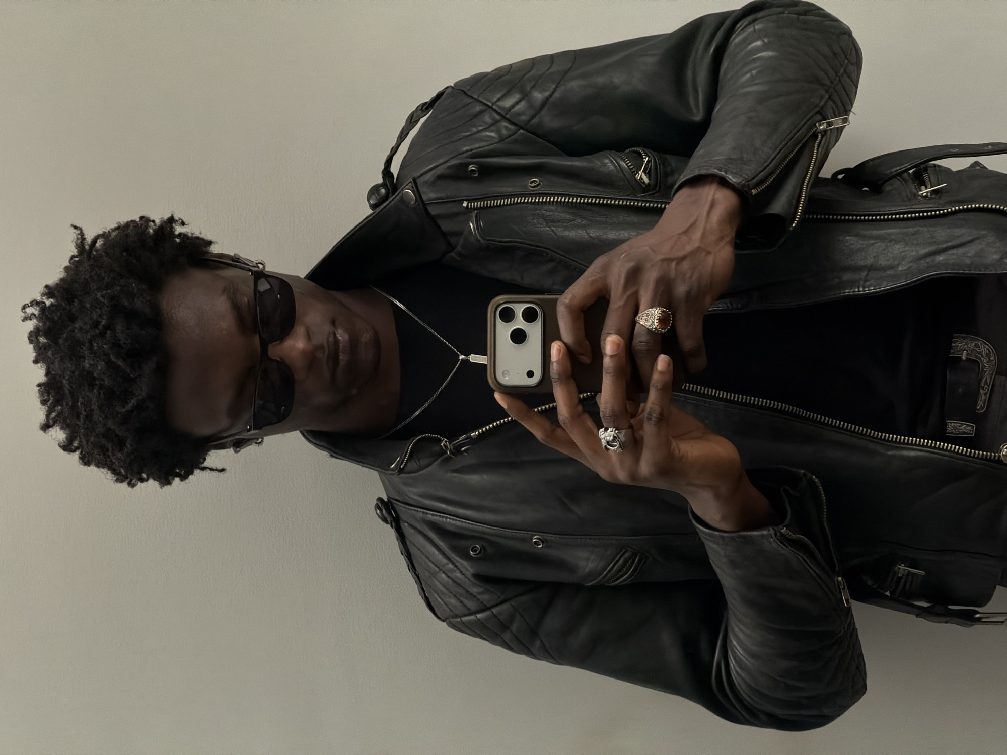 Man photographs himself with smartphone in London morning