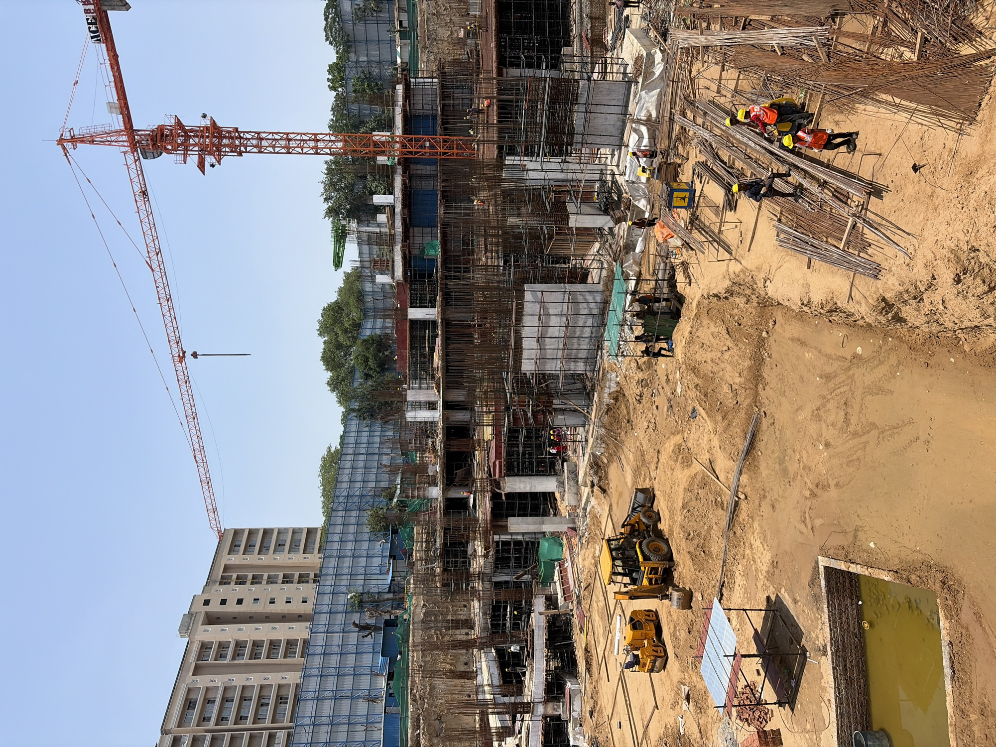 Active construction site in New Delhi, foundation to upper floors
