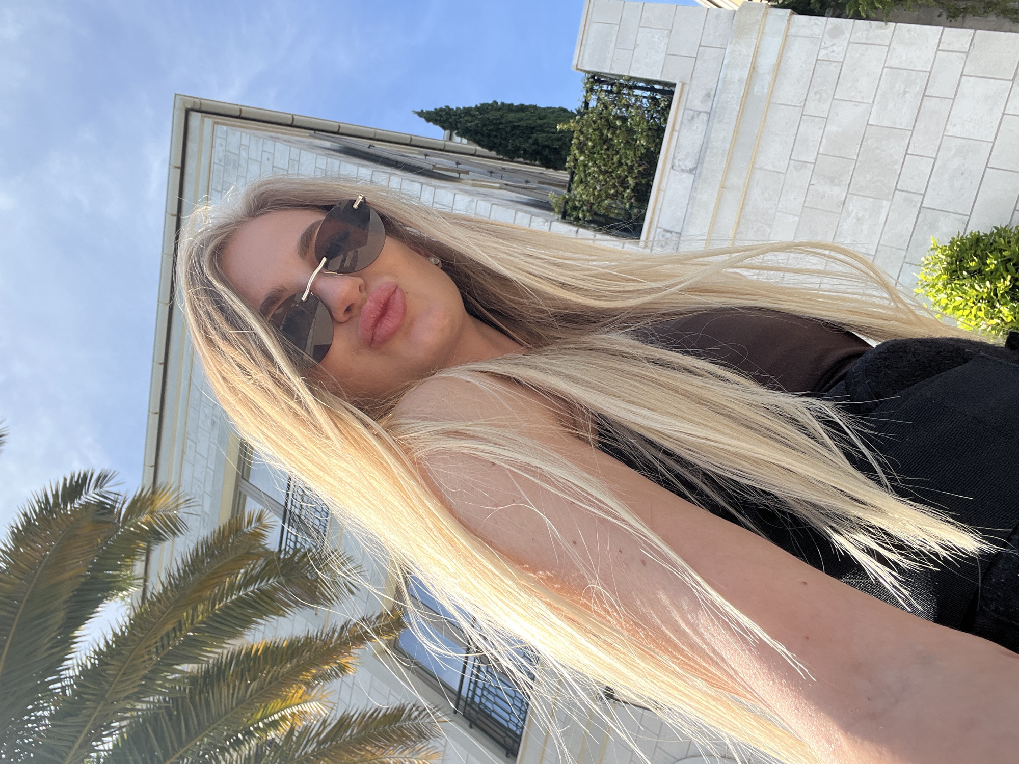 Woman poses for photos in Tivat marina district