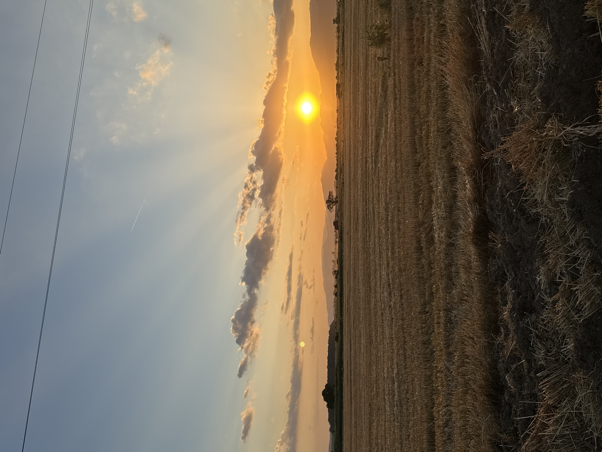 Harvest sunset over the fields and rooftops of Blatets, Bulgaria