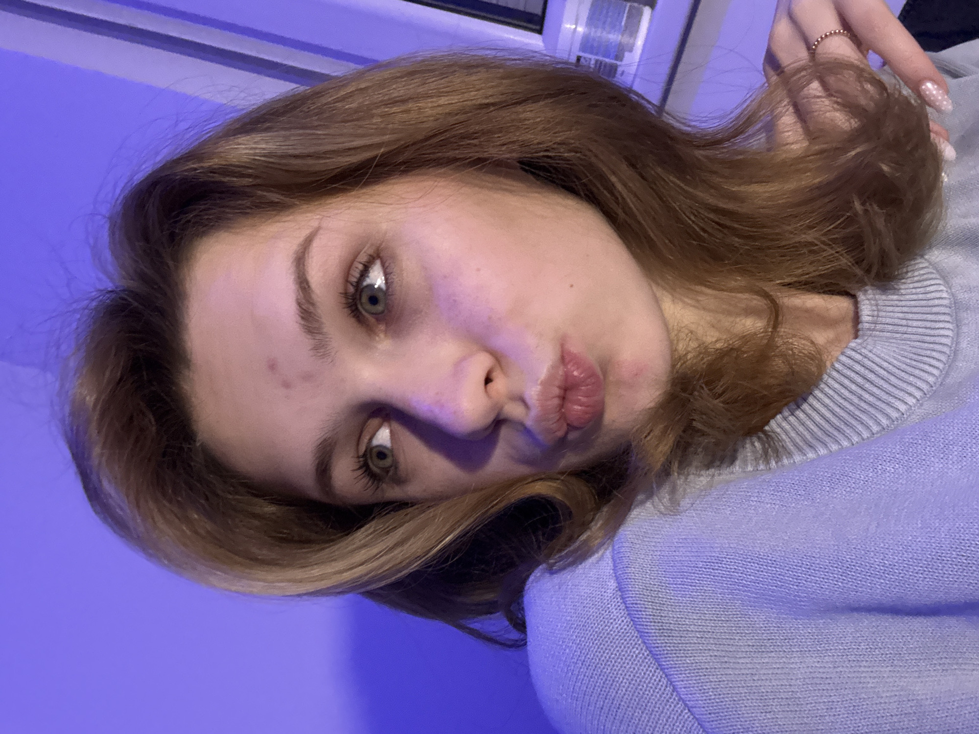 Woman poses for camera with pouting expression in Kragujevac