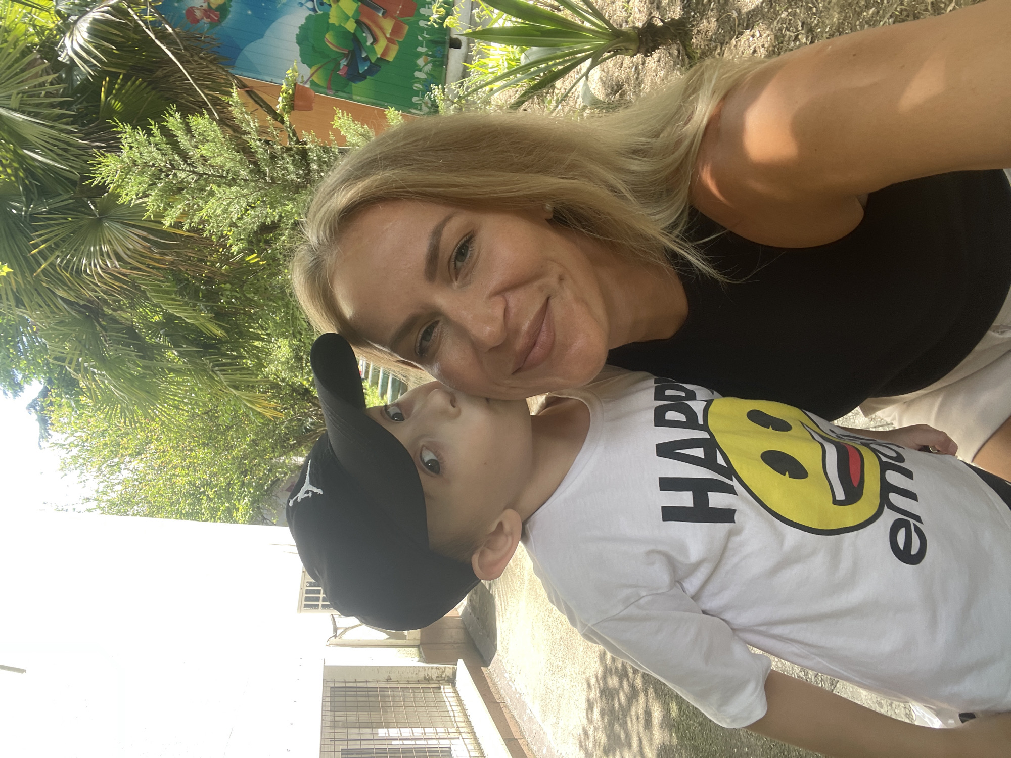Mother and son share casual moment in Sochi